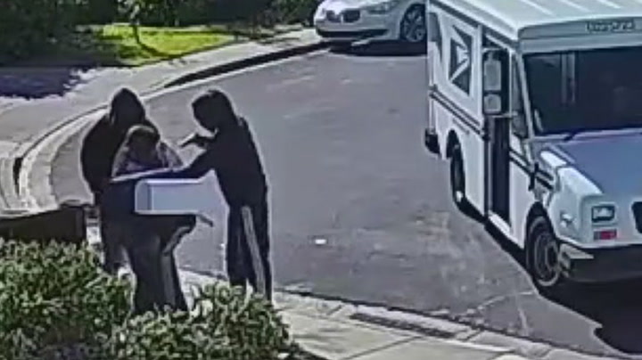 Armed robbery of US postal worker caught on CCTV in California | News