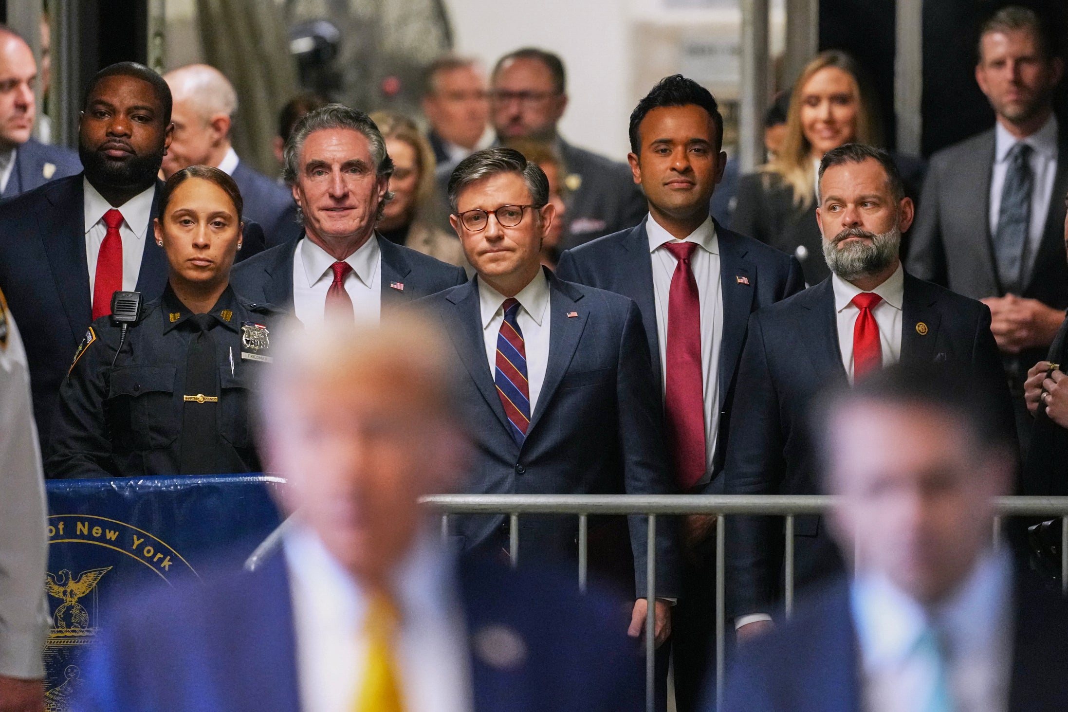 Trump is flanked by his ‘surrogates’ at the courthouse