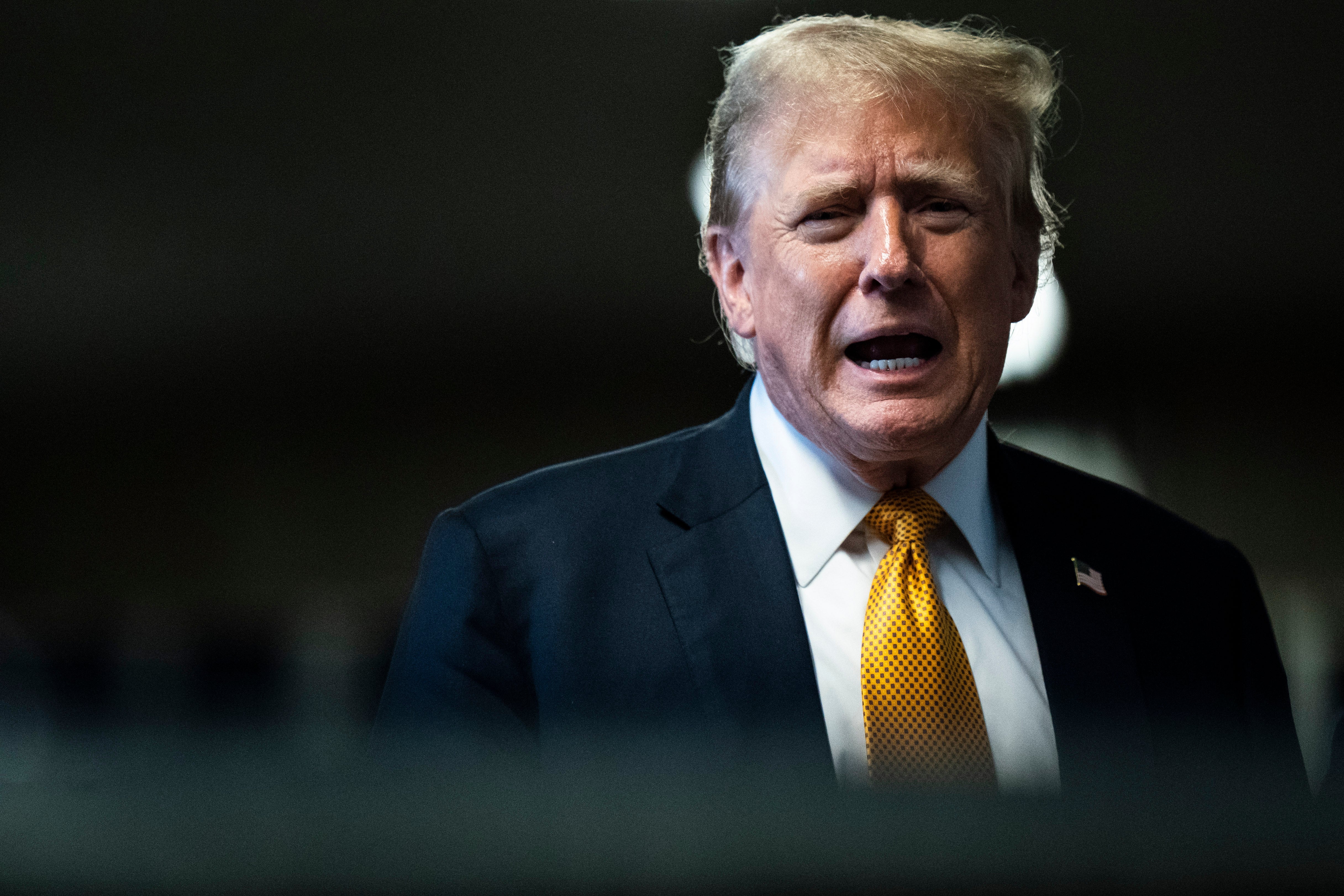 Donald Trump speaks to reporters outside his hush money trial in Manhattan on May 29.