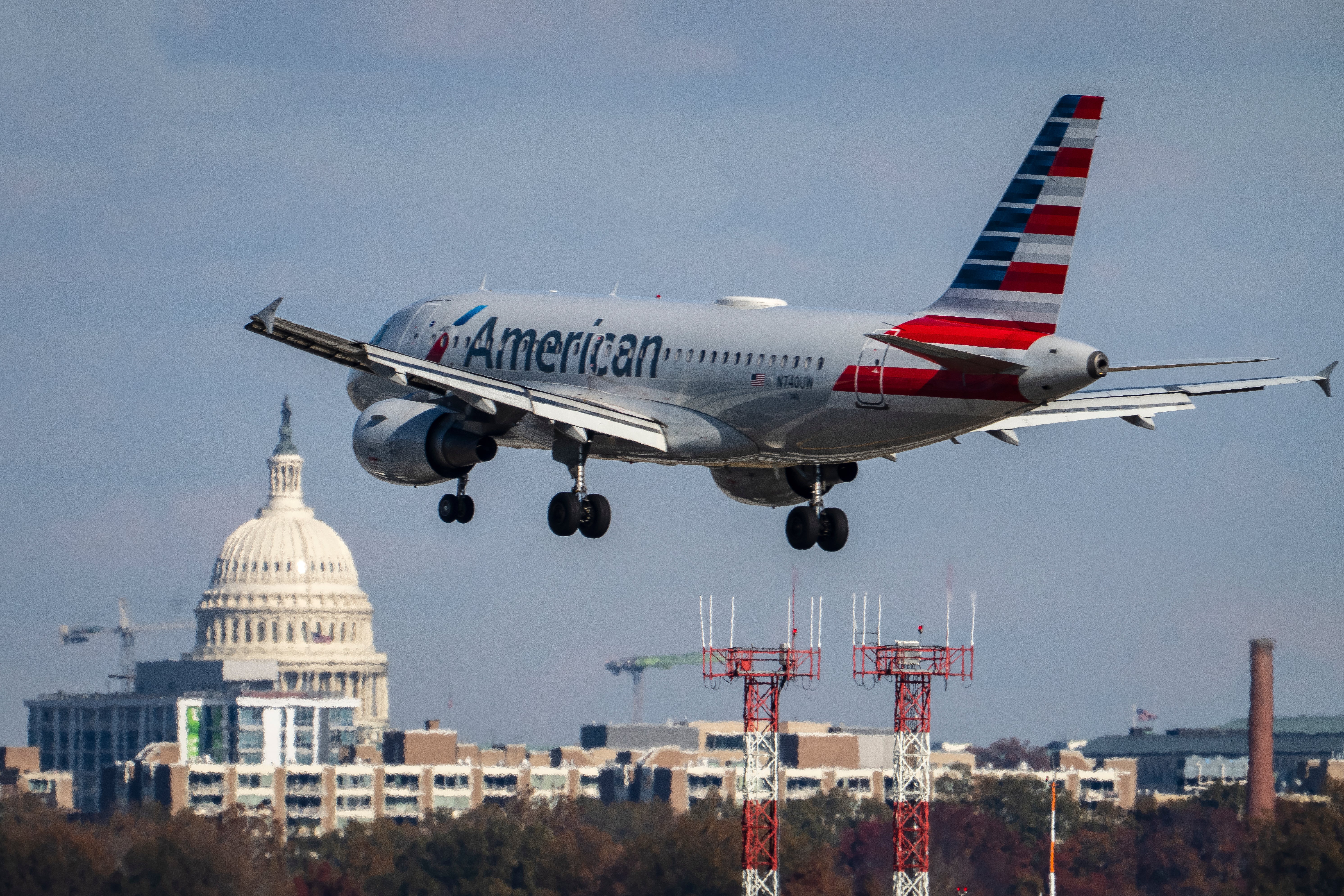 An American Airlines flight pictured landing at the Ronald Reagan Washington National Airport outside of Washington, DC. An American Airlines flight almost collided with a private plane on Wednesday morning after both flights were cleared to use intersecting runways