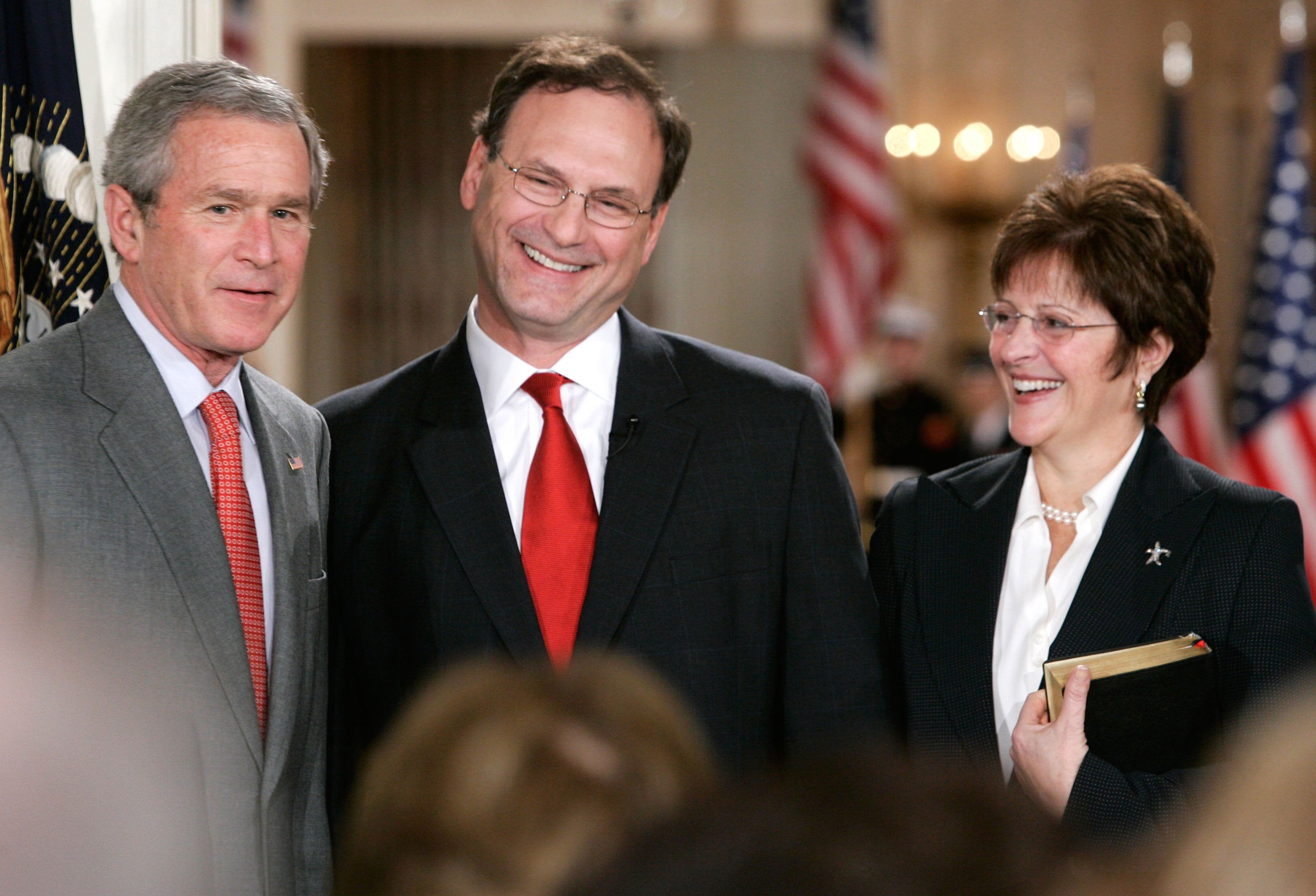 Supreme Court Justice Samuel Alito and Martha-Ann Alito share a smile during a ceremonial swearing-in at the East Room of the White House February 1, 2006