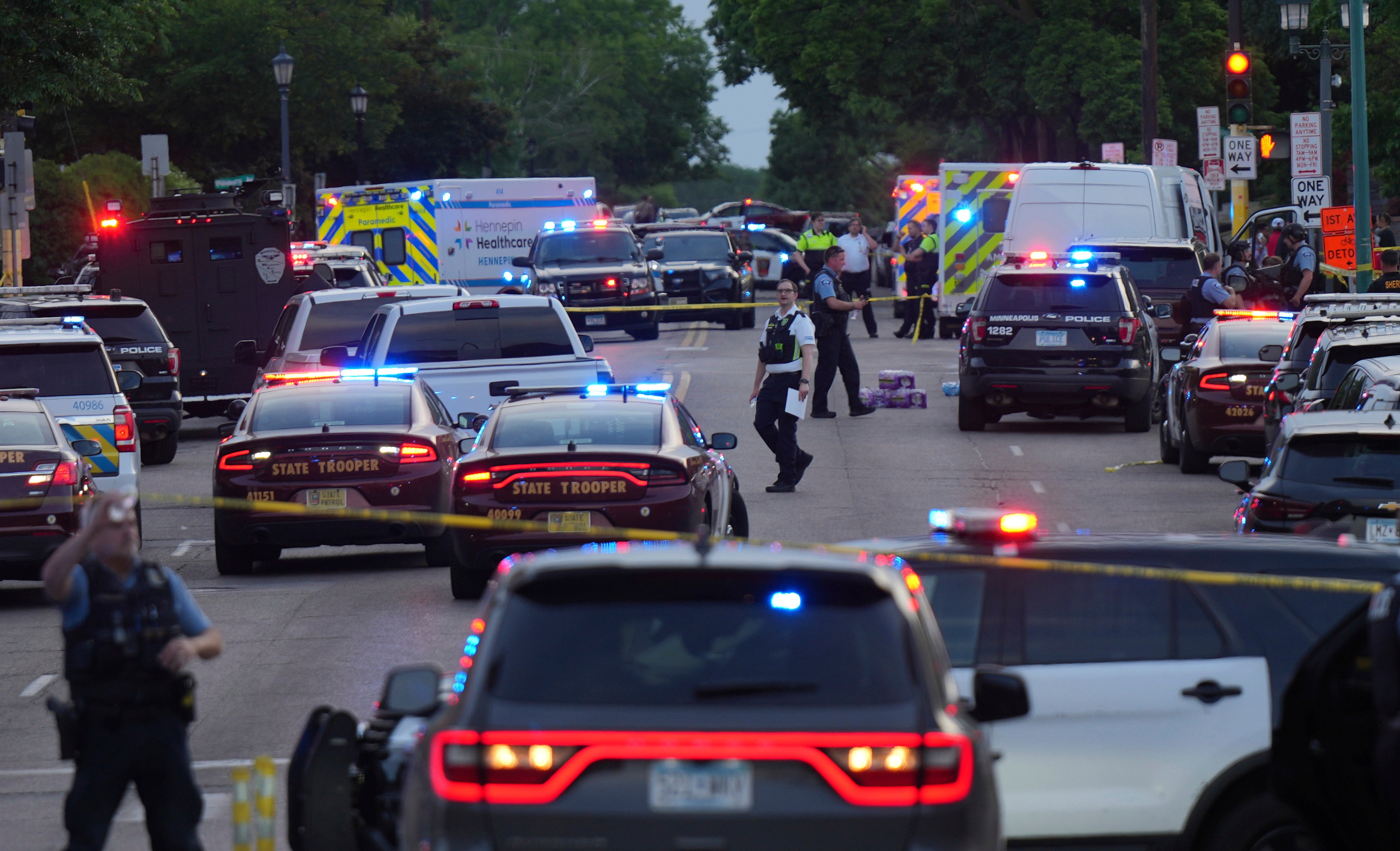 Investigators examine the scene of the shooting