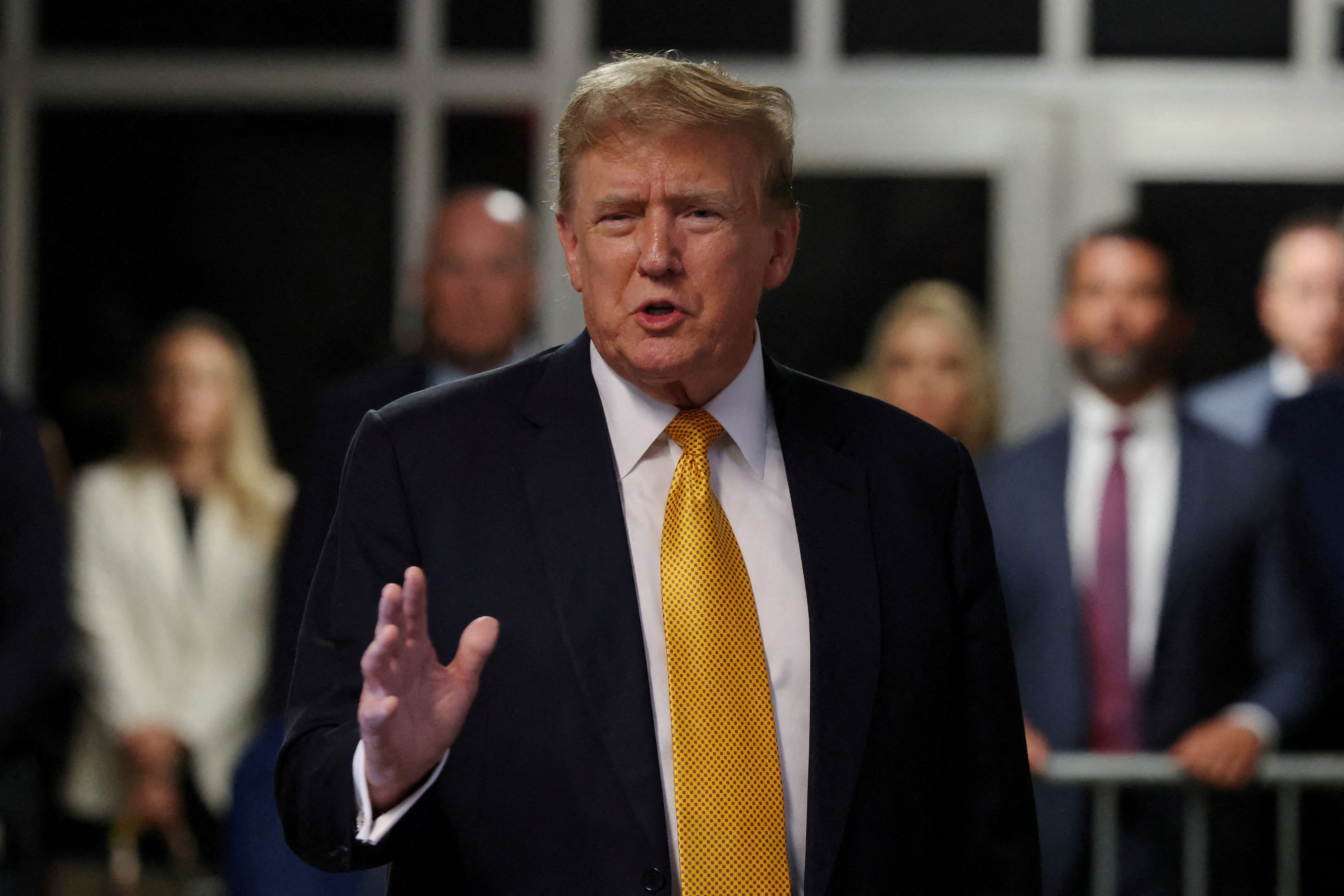 Donald Trump speaks after a break during his hush money trial at the Manhattan Criminal Court in New York City on 21 May