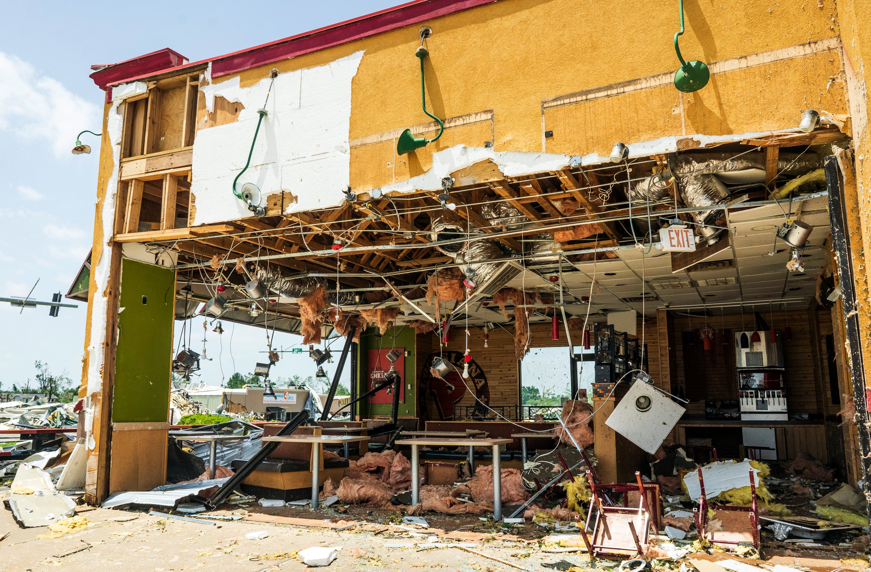 A Popeyes location is damaged from the storm at a shopping centre May 26, 2024, in Rogers, Arkansas