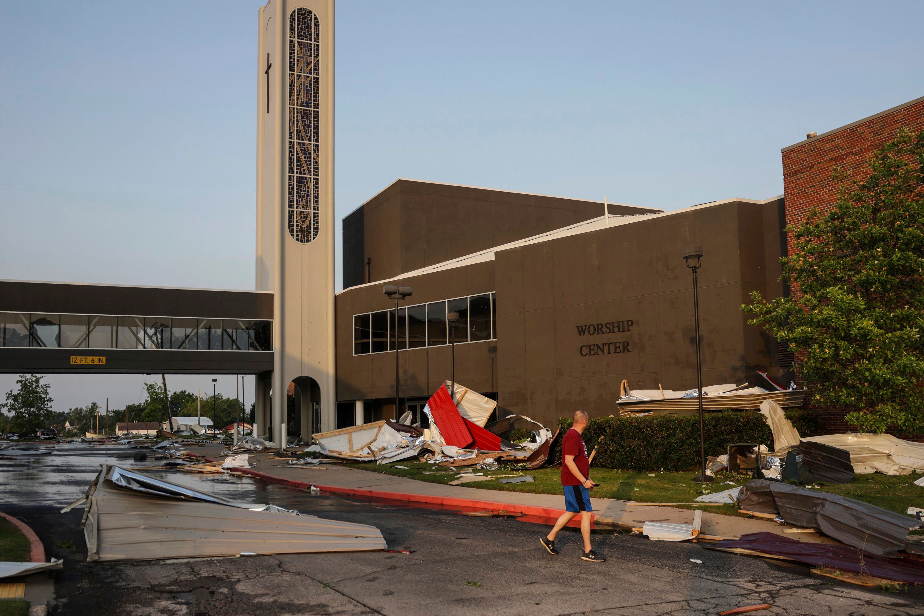 A man views damage at First Baptist Church near downtown, Sunday, May 26, 2024, in Claremore, Oklahoma