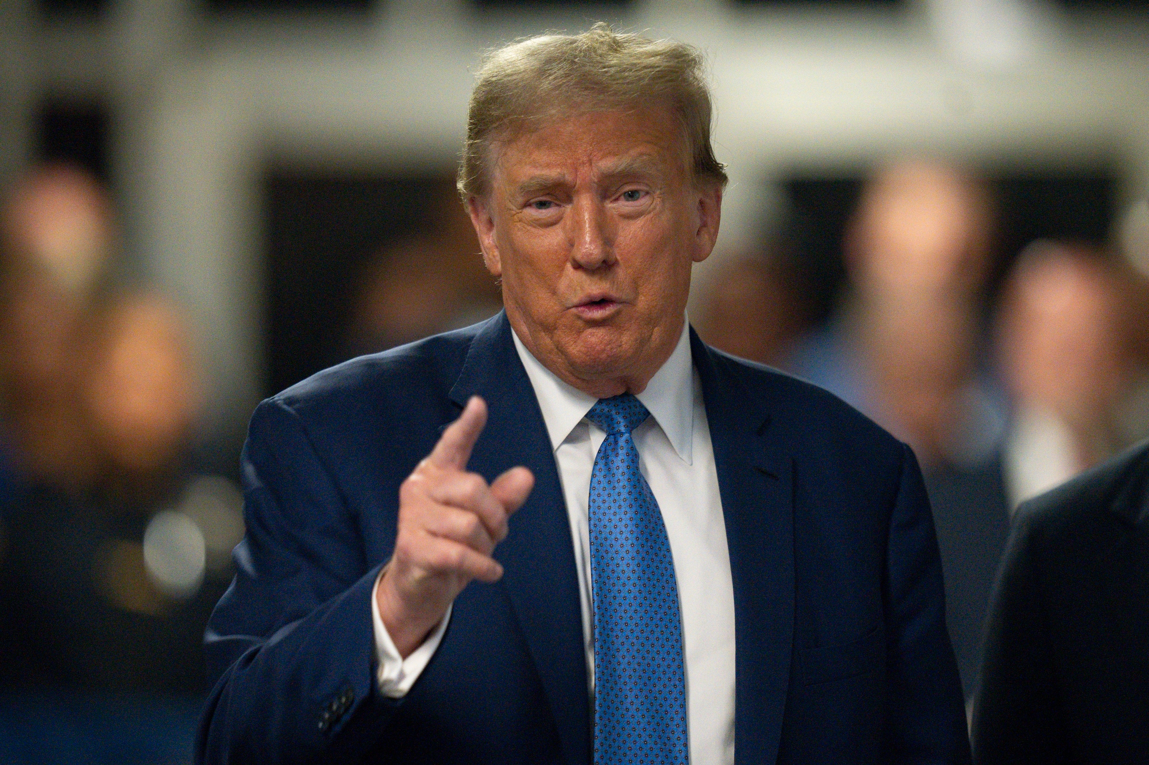 Former president Donald Trump speaks to reporters at Manhattan Criminal Court in New York on Monday 20 May 2024