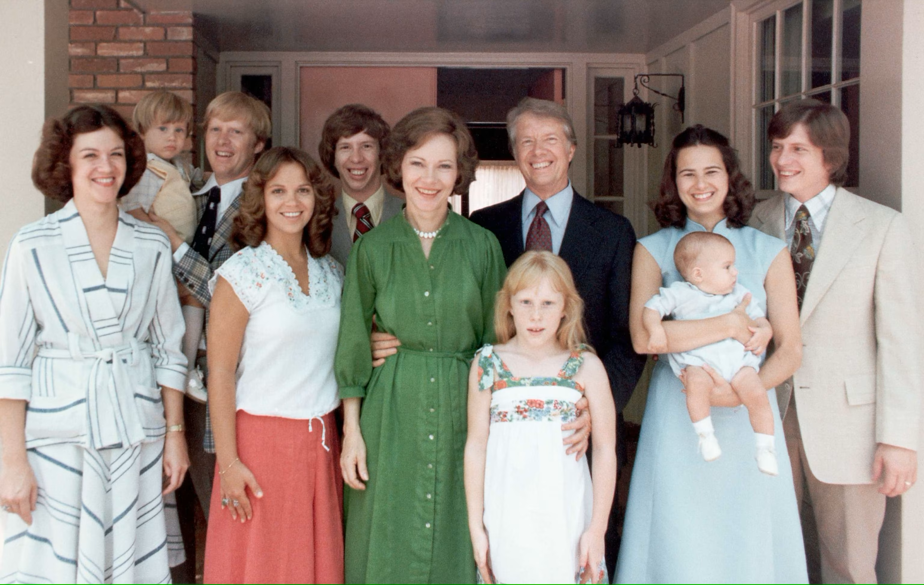 Rosalynn Carter and her family. Left to right: Judy (Jack Carter’s wife); Jason James Carter; Jack Carter; Annette ( Jeff Carter’s Wife); Jeff Carter; Rosalynn Carter; Amy Carter; Jimmy Carter; Caron Griffin Carter(Chip Carter’s wife) holding James Earl Carter IV; Chip Carter