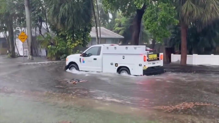 Miami residents wade through rain amid life-threatening flood warnings | News