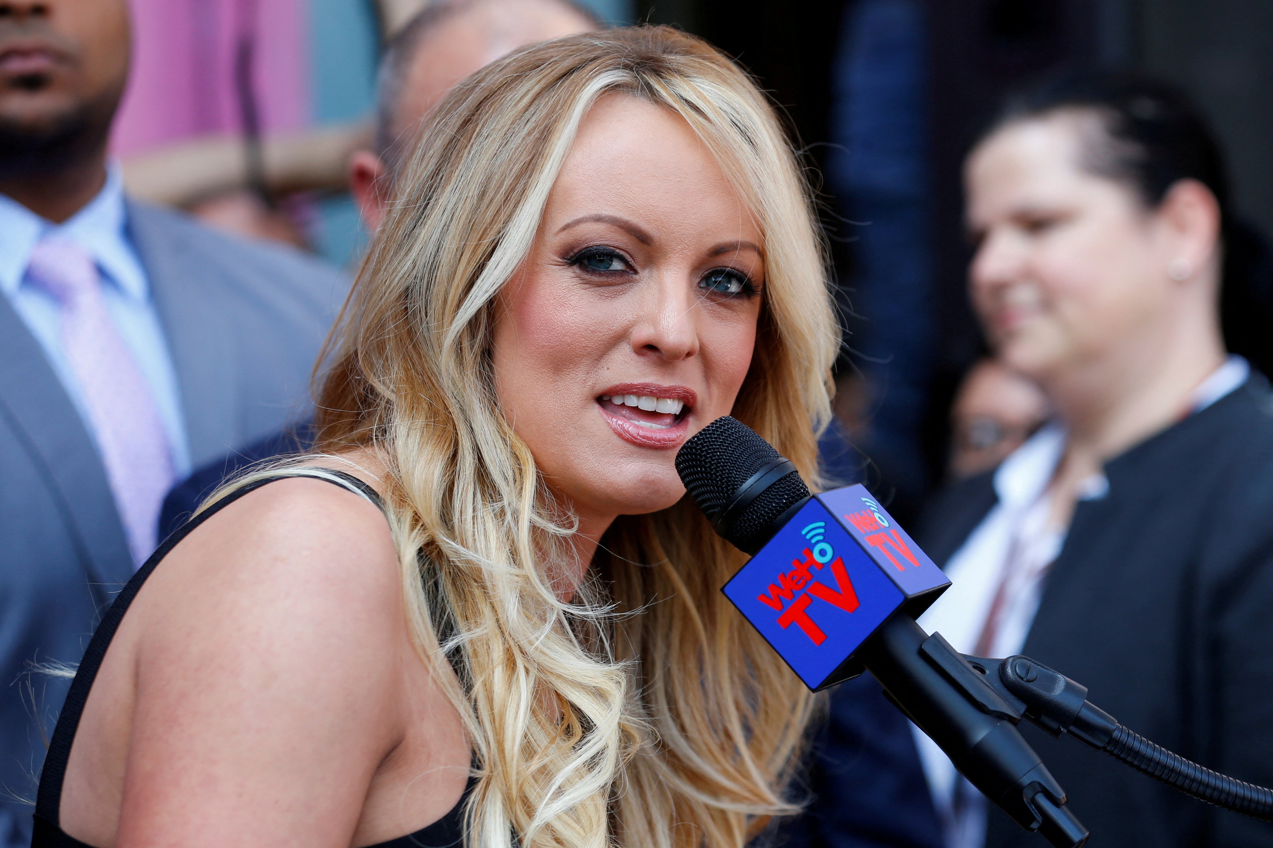 Stormy Daniels, who was paid hush money by Donald Trump’s attorney Michael Cohen under the former president’s direction, speaks to reporters in 2018.