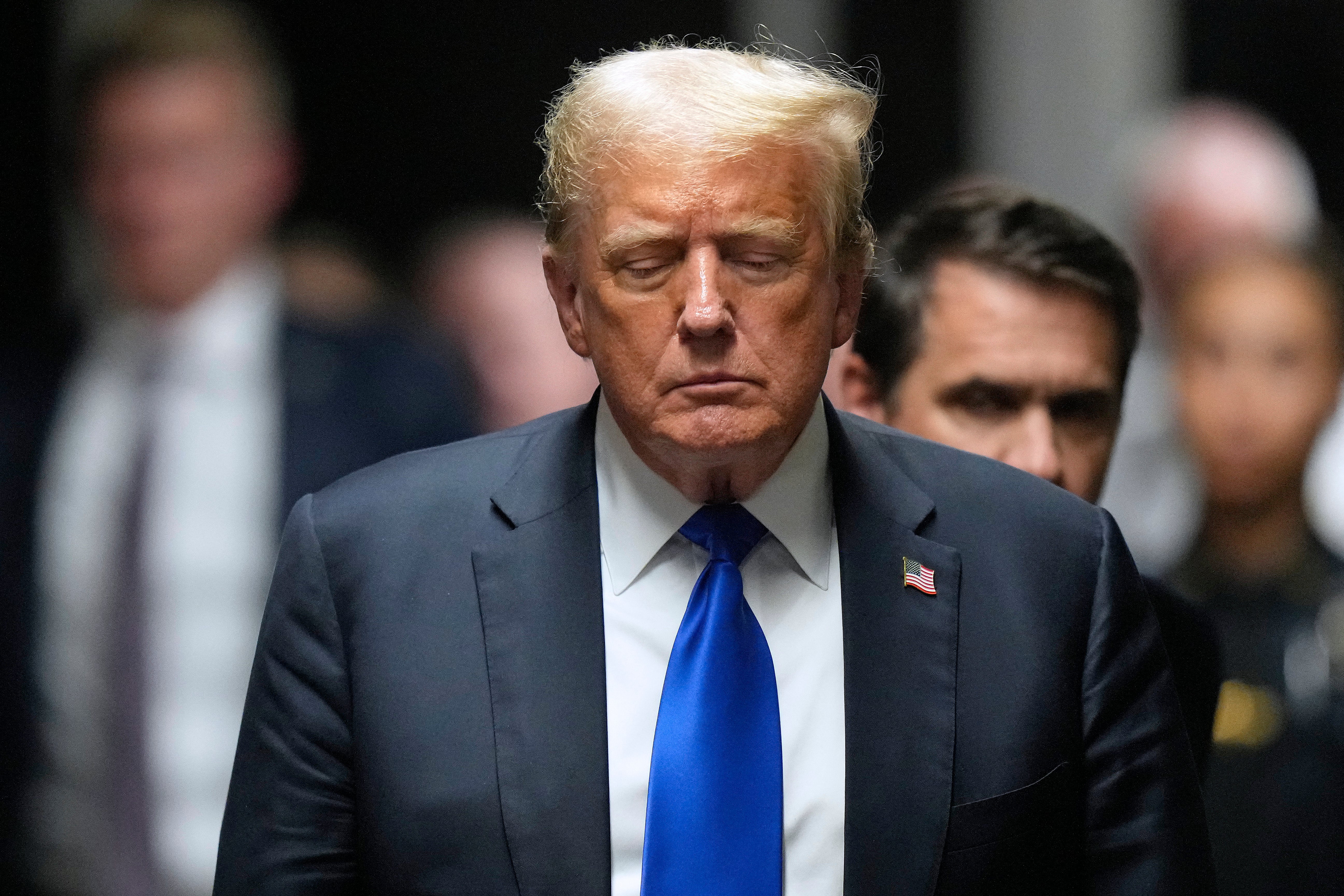 Donald Trump leaves criminal courtroom after he was convicted on all felony counts of falsifying business records in New York on May 30