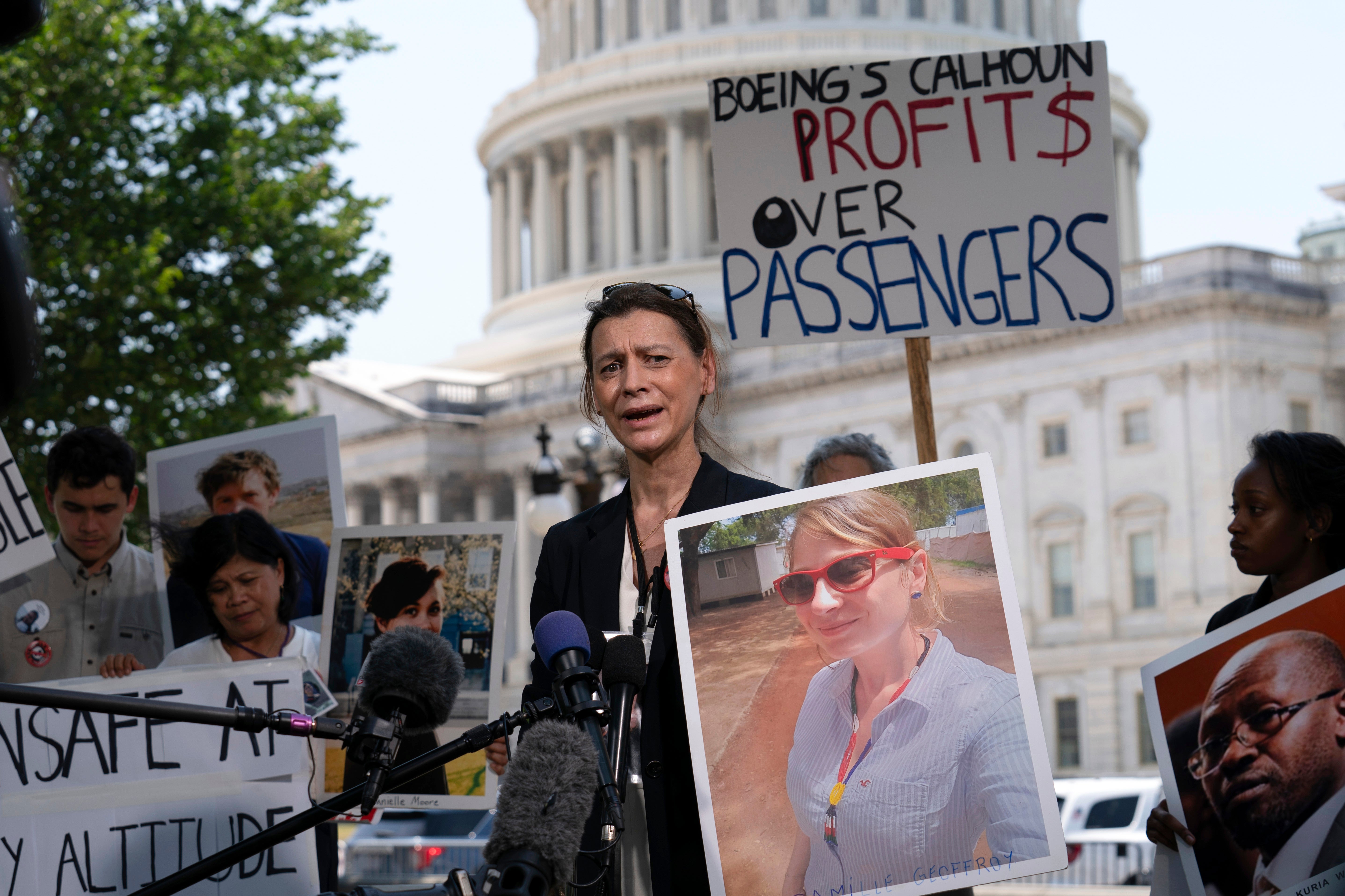 Family members of crash victims attended the hearing, many carrying pictures of their loved ones