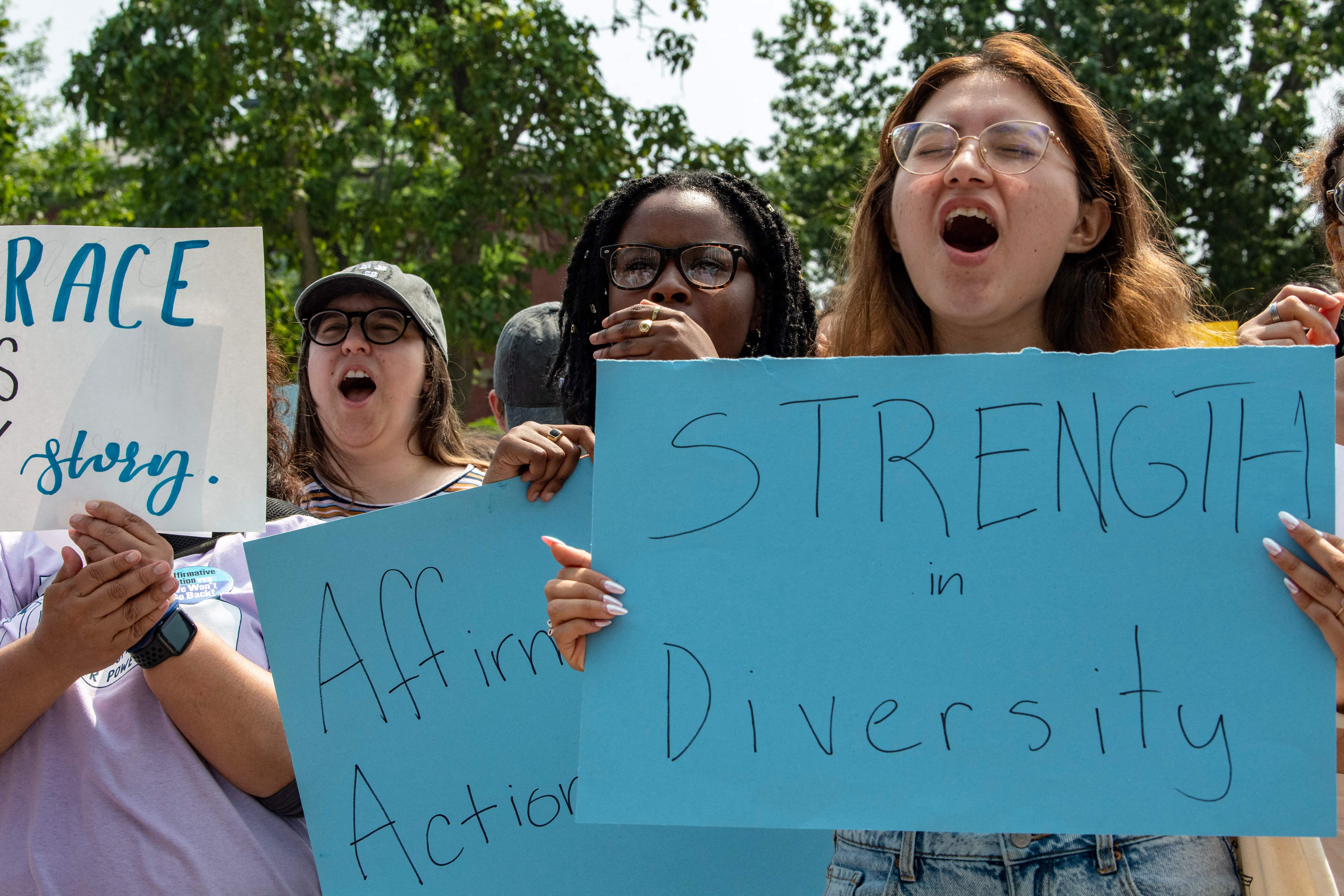 Proponents of affirmative action hold signs during a protest at Harvard University in Cambridge, Massachusetts, on July 1, 2023.