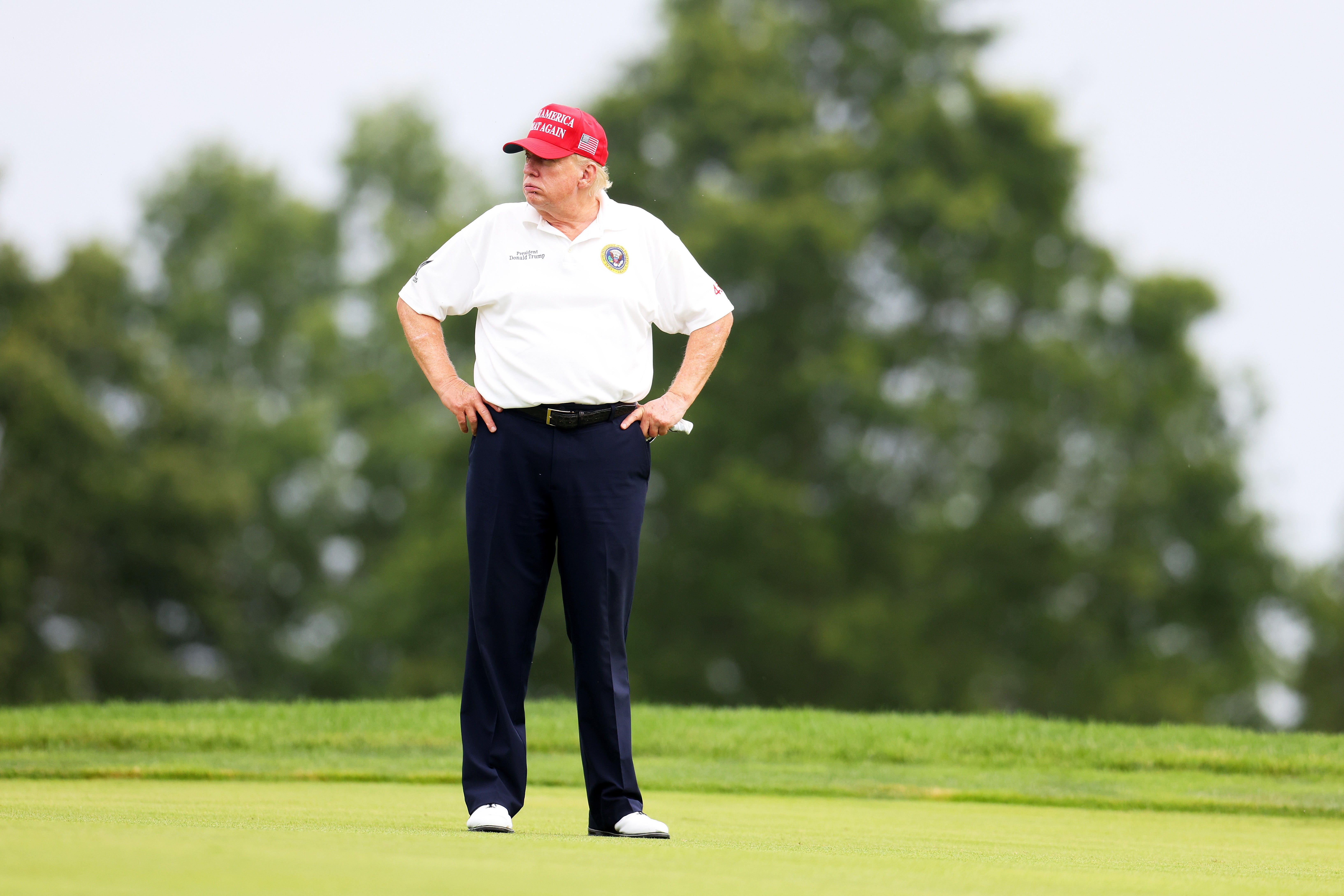 Former President Donald Trump looks on during the pro-am prior to the LIV Golf Invitational - Bedminster at Trump National Golf Club on August 10, 2023