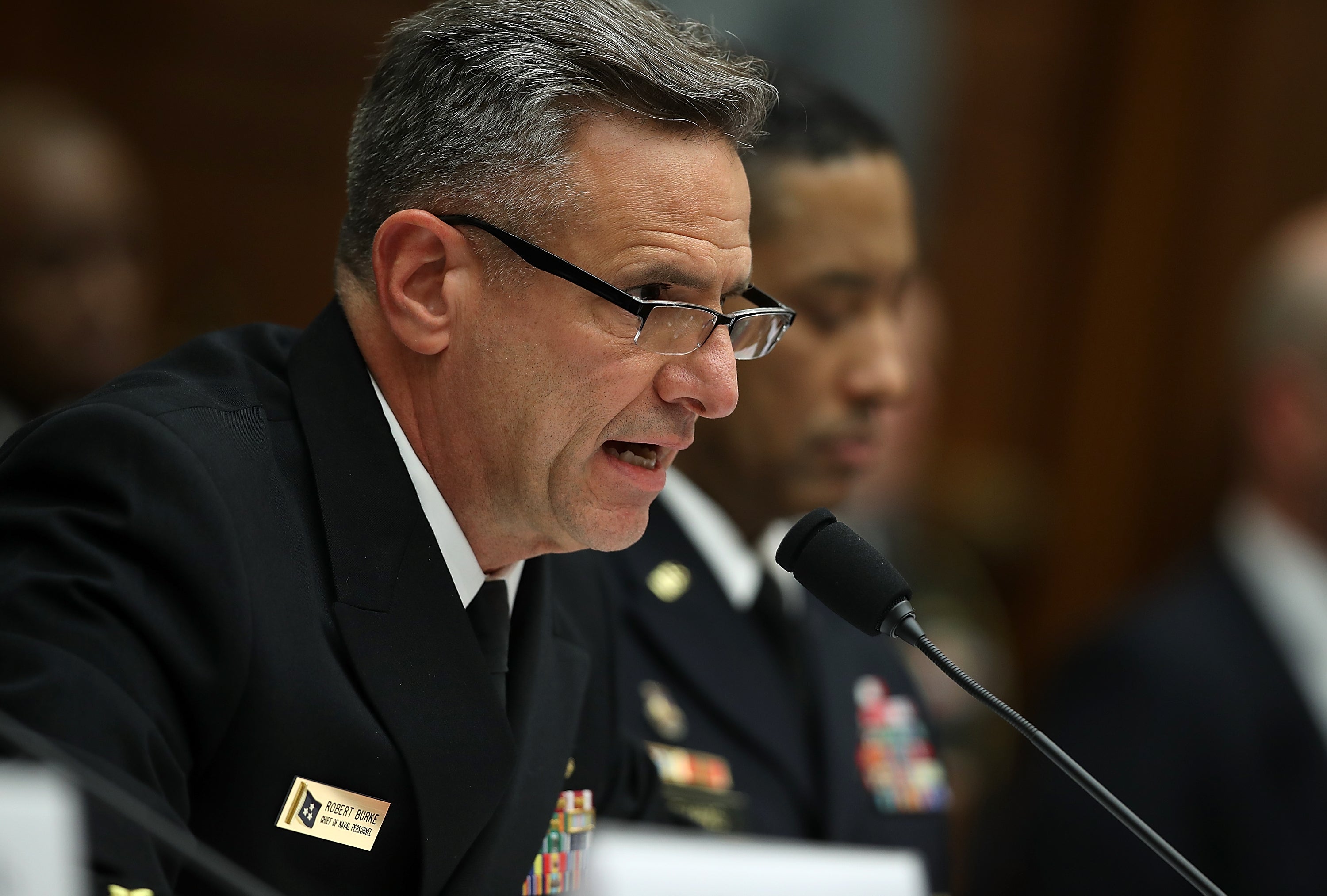 Admiral Robert Burke, pictured in 2017, has been charged with conspiracy to commit bribery and bribery by the US Department of Justice