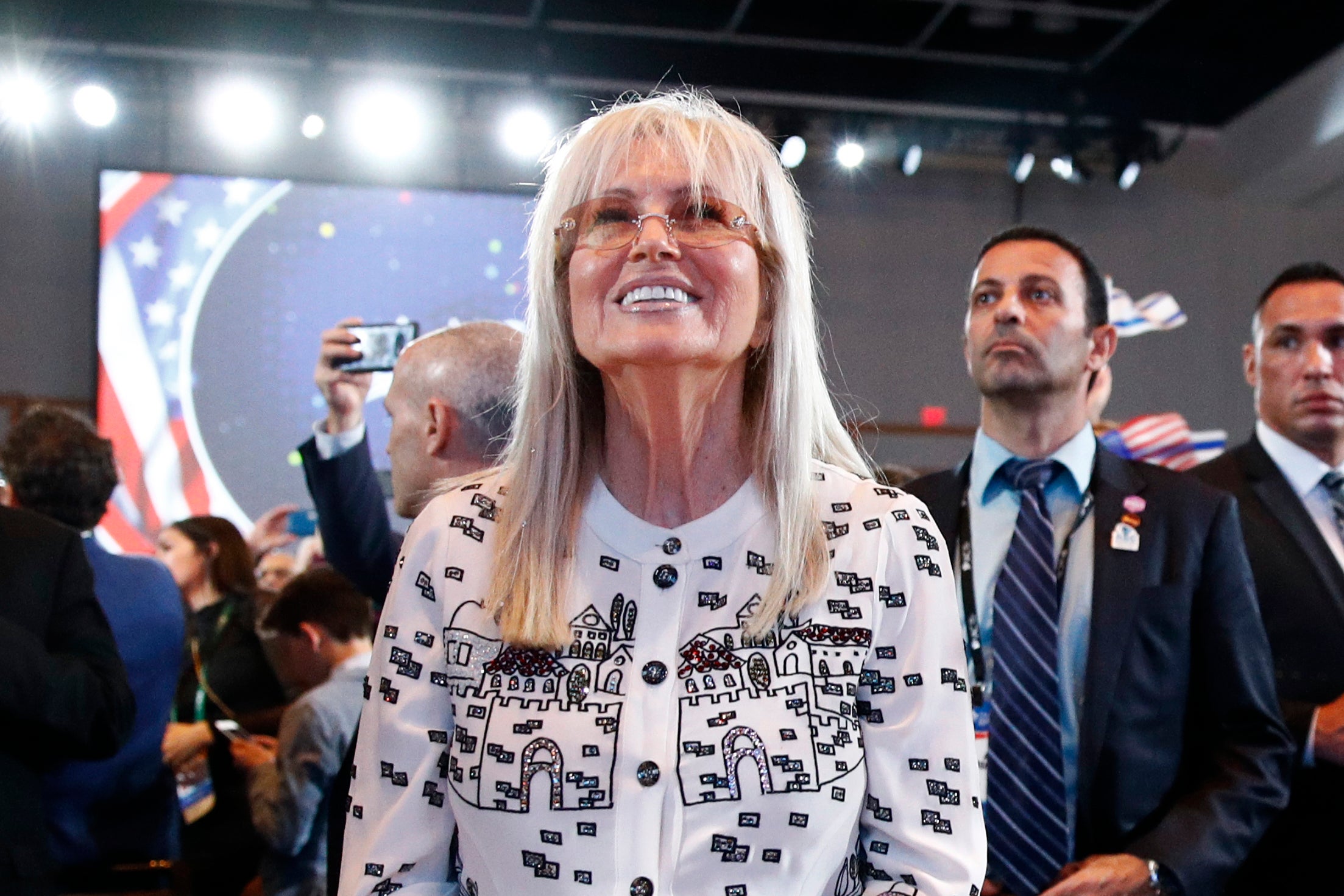 Miriam Adelson, wife of Las Vegas Sands Corporation Chief Executive and Republican mega donor Sheldon Adelson, listens as President Donald Trump speaks at the Israeli American Council National Summit in Hollywood, Fla., Saturday, Dec. 7, 2019.