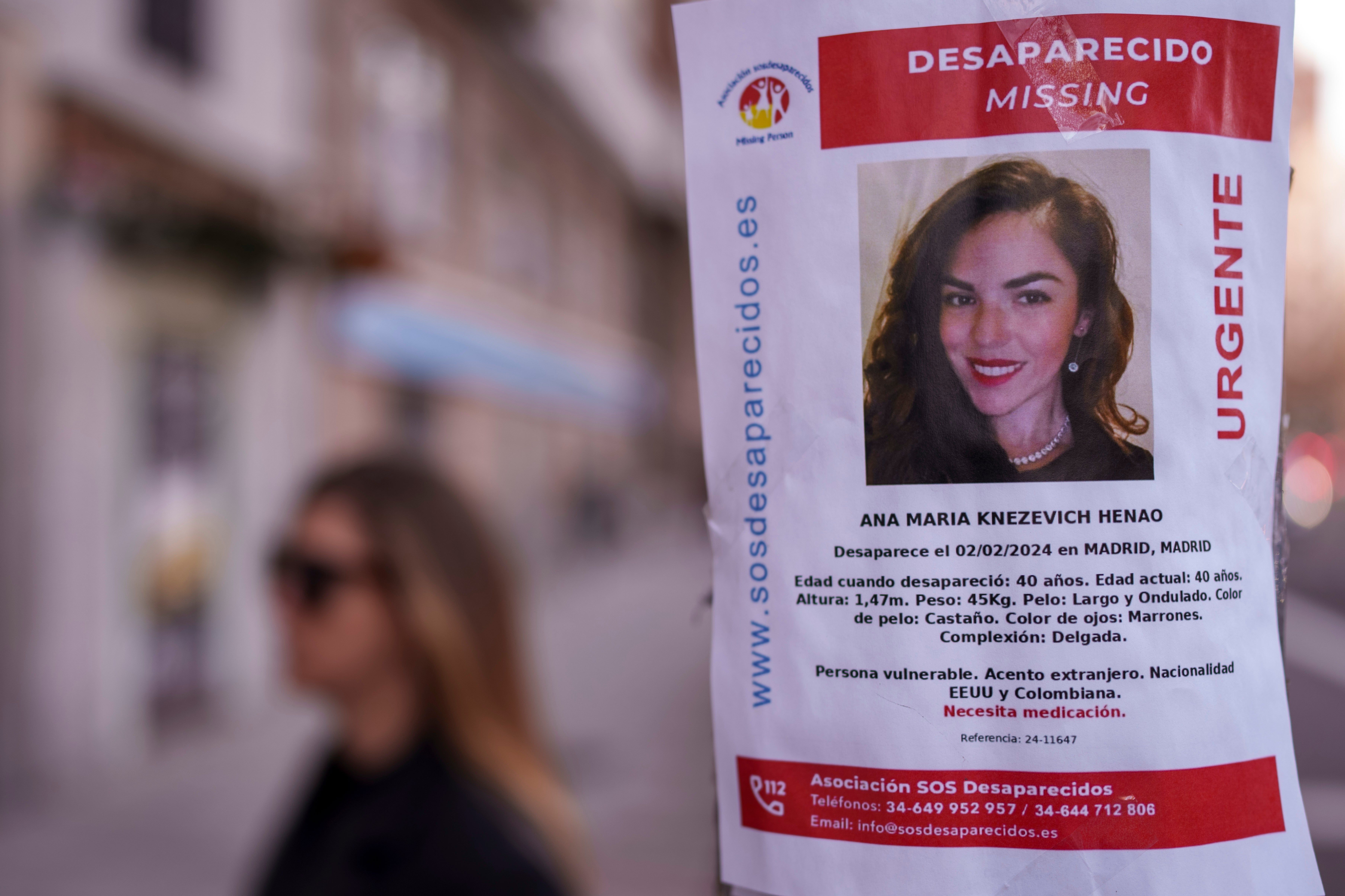 A missing persons poster for Henao, plastered on a streetlight in Madrid, Spain