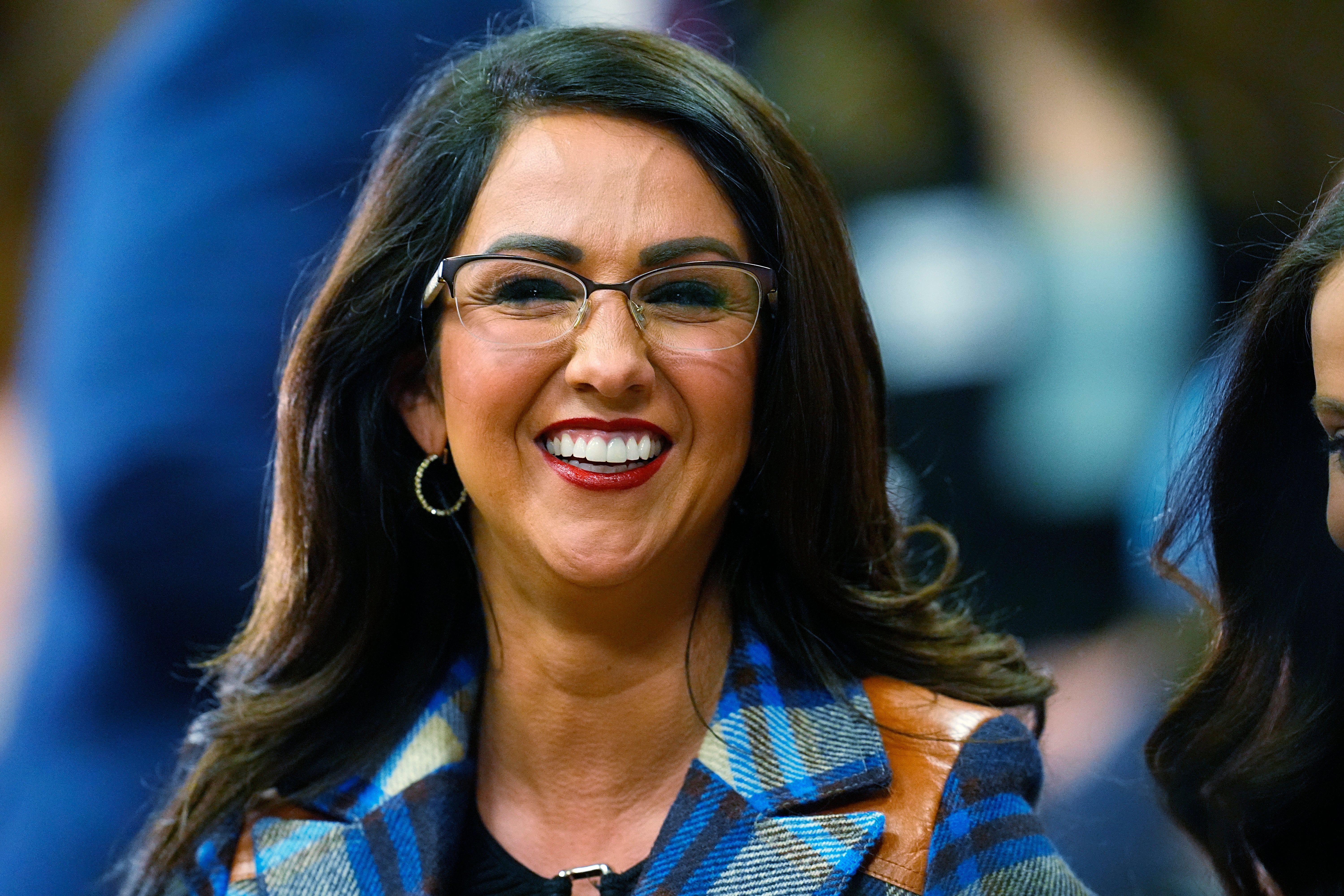 Boebert smiles before the first Republican primary debate for the 4th Congressional district in January in Fort Lupton, Colorado; her move to an already-crowded Republican primary caused rancor within some factions the party