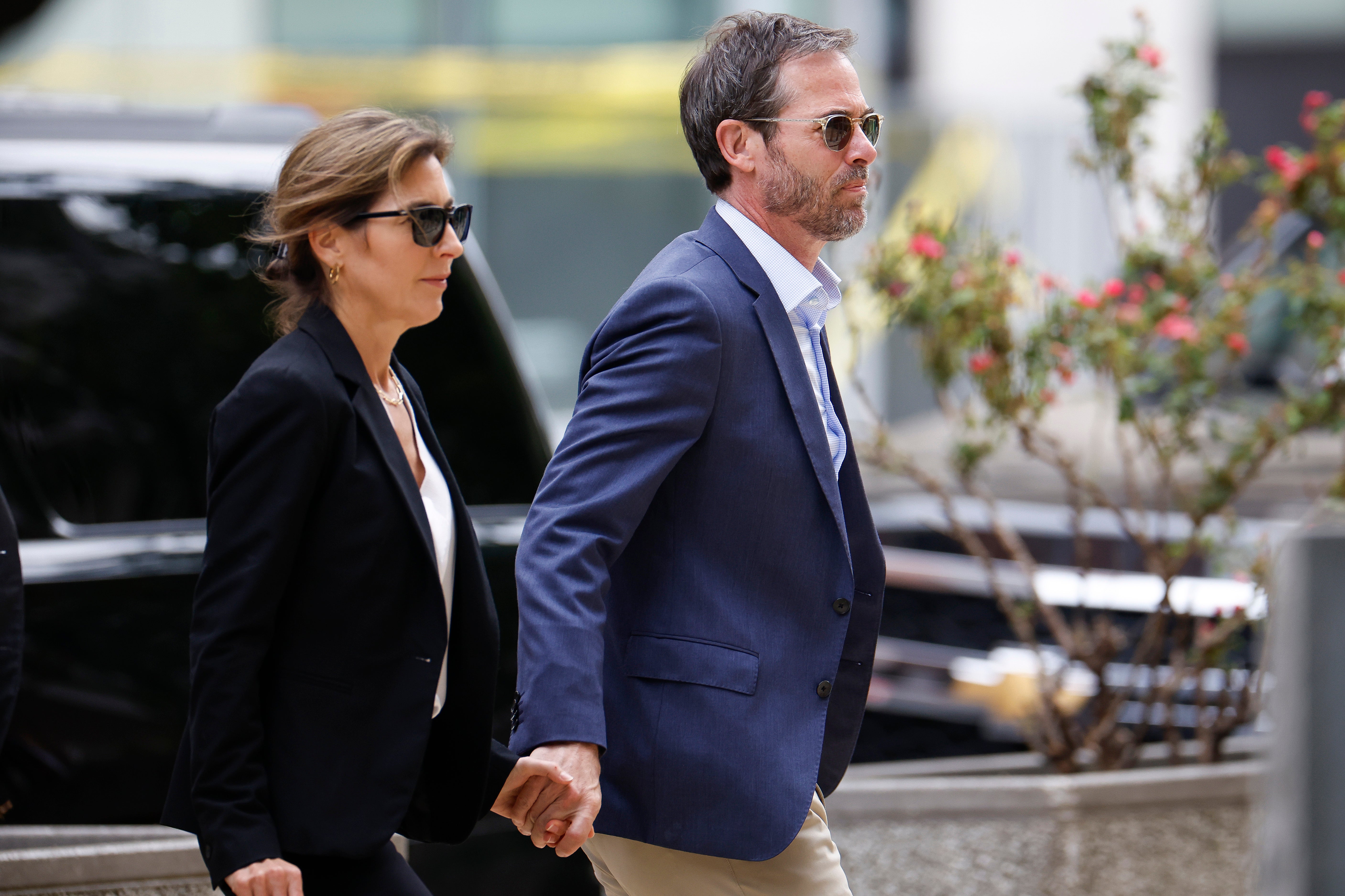 Hallie Biden (left) walks with her husband John Hopkins Anning (right) to federal court on Thursday June 6