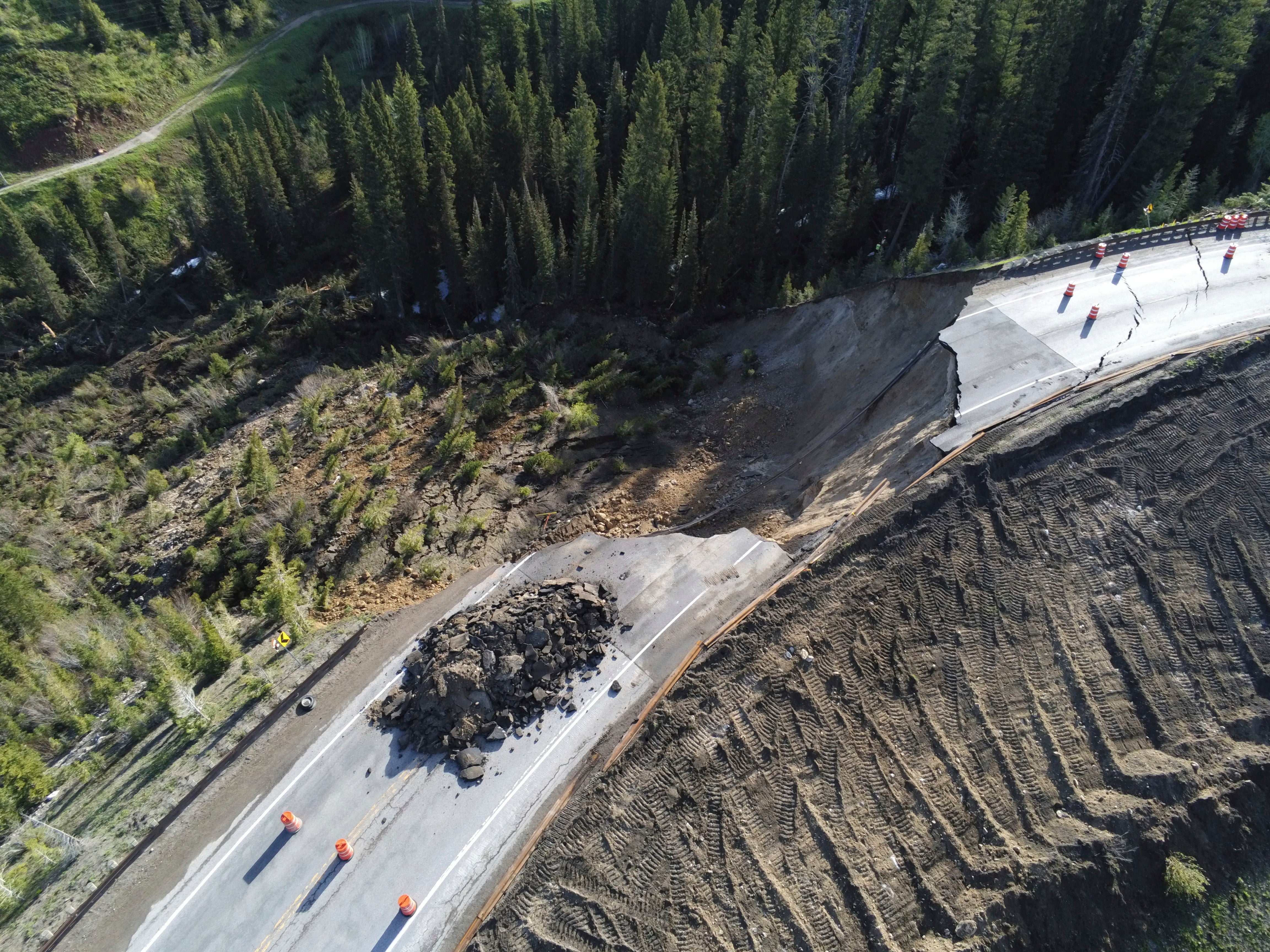 This photo provided by Wyoming Highway Patrol shows a damaged section of Teton Pass near Jackson