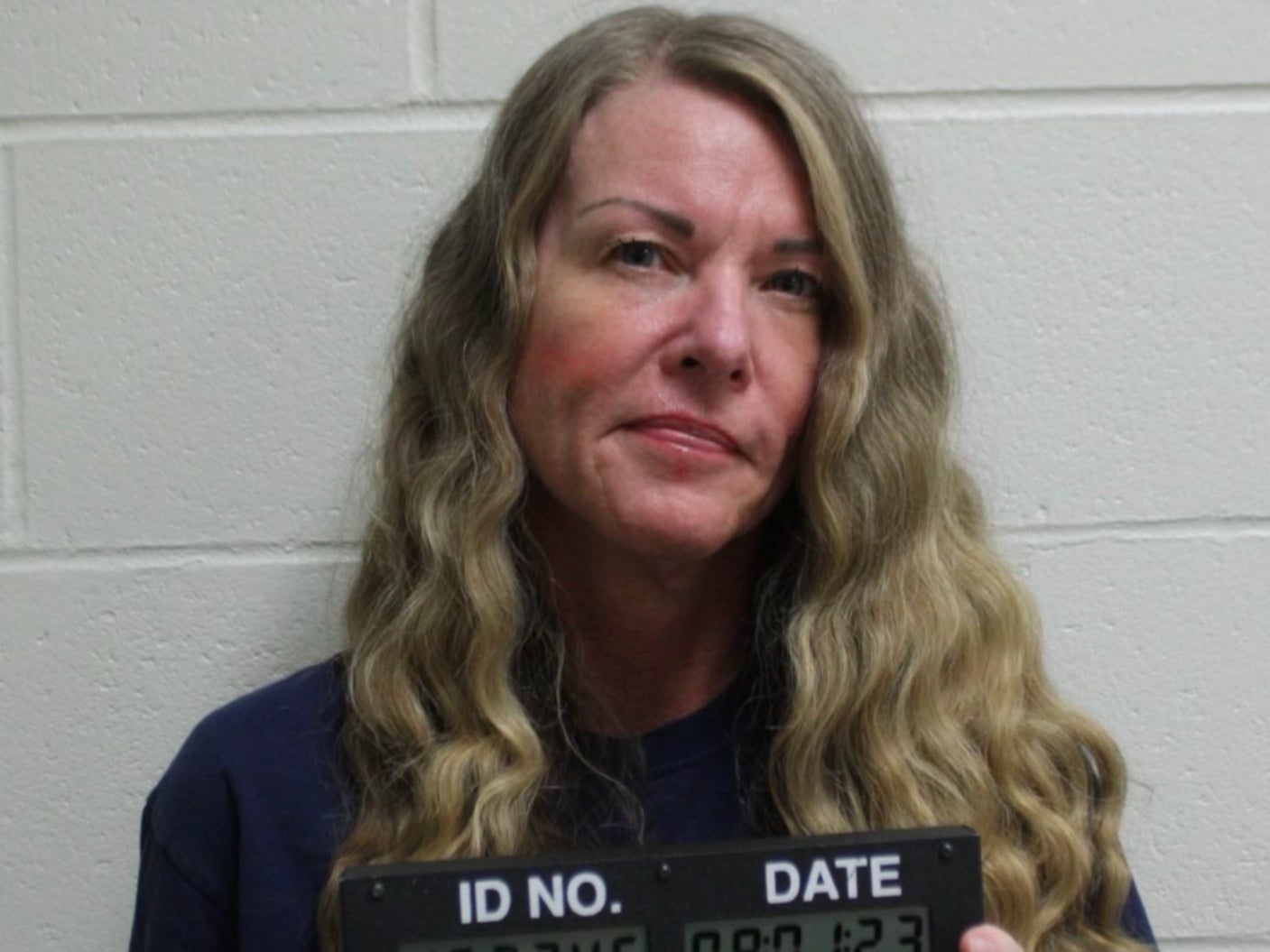 Lori Vallow smirks in her mug shot after being handed life without parole