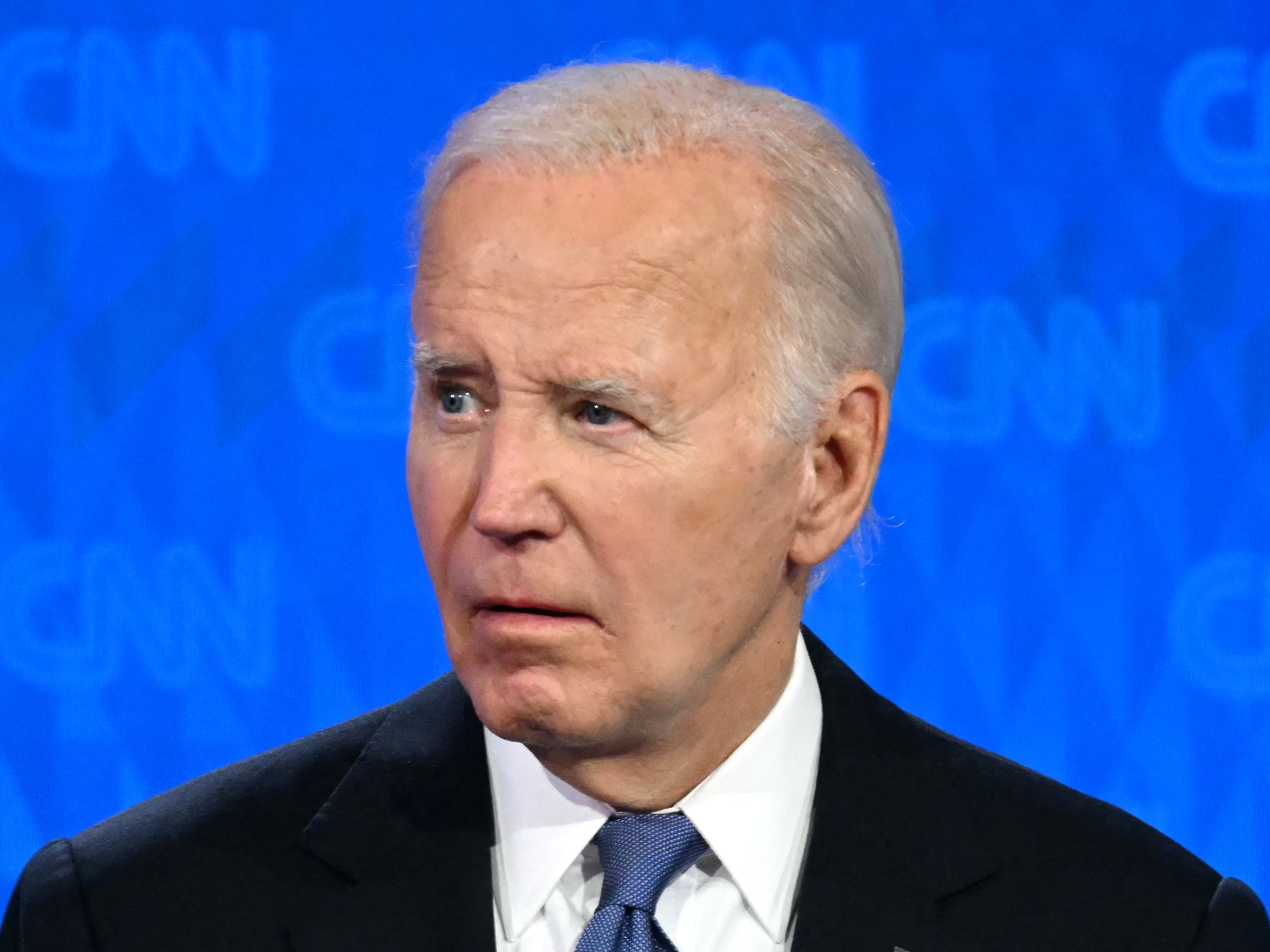 Joe Biden looks on as Donald Trump speaks during the first presidential debate of the 2024 general election in June