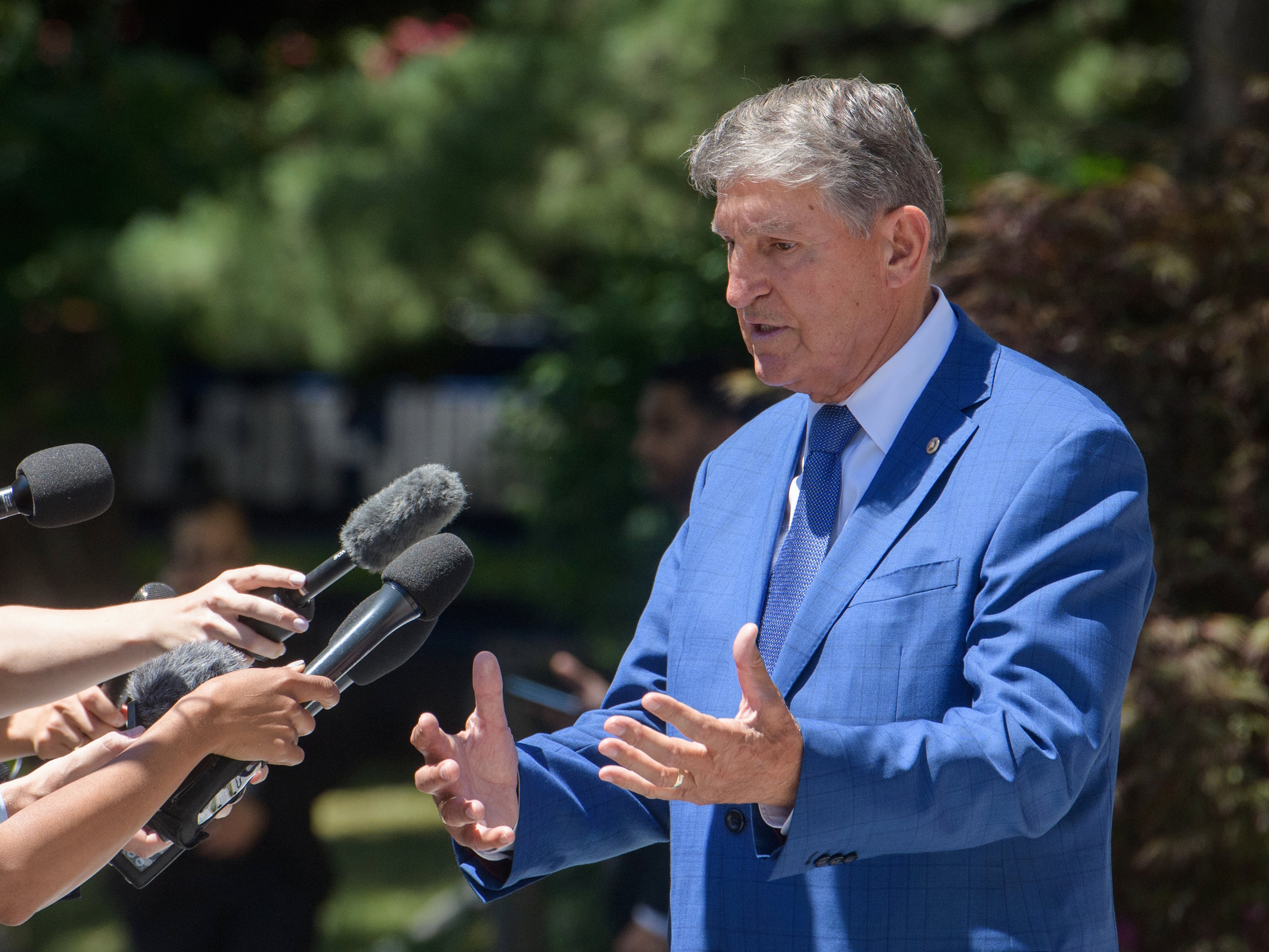 Independent senator Joe Manchin, who bizarrely claimed not to know whether he’d voted to restrict trans healthcare, talks with reporters on July 11, 2024