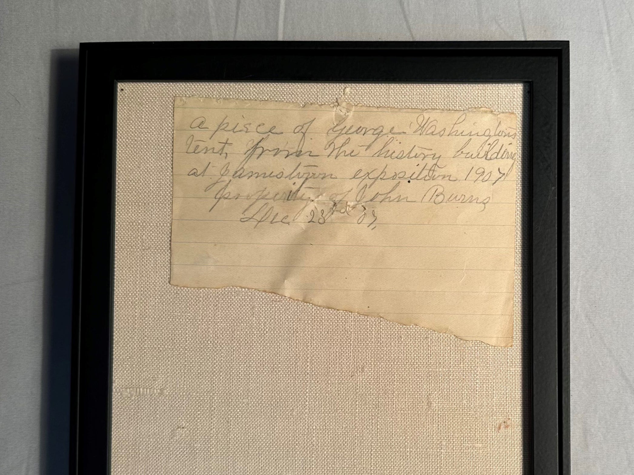 A note that accompanied the fragment. It reads: “A piece of George Washingtons tent, from the history building at Jamestown exposition 1907, property of John Burns, Dec 23rd 07.”