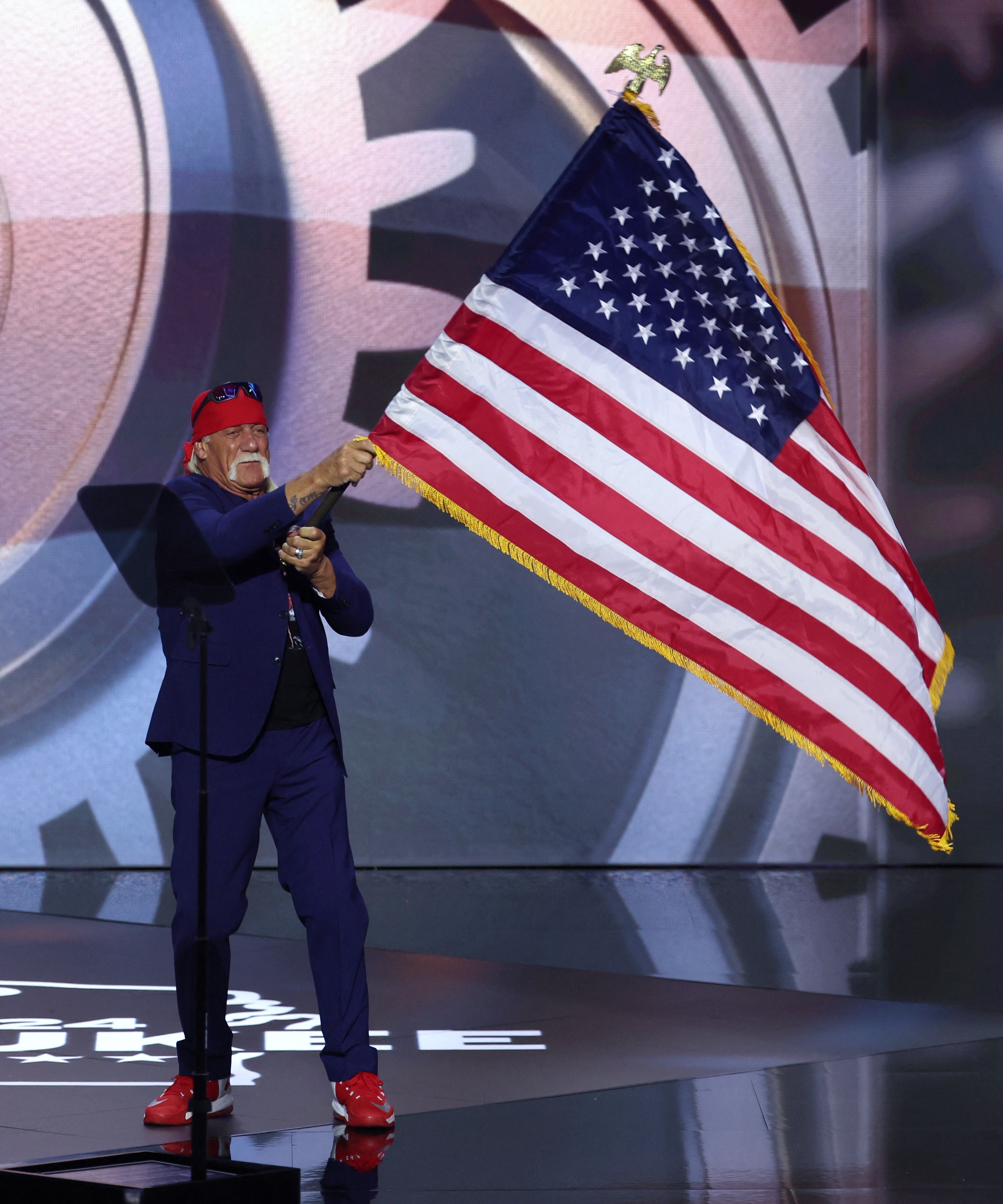 Hogan bounded onto the stage to his former wrestling theme tune ‘Real American’ and waving an enormous US flag