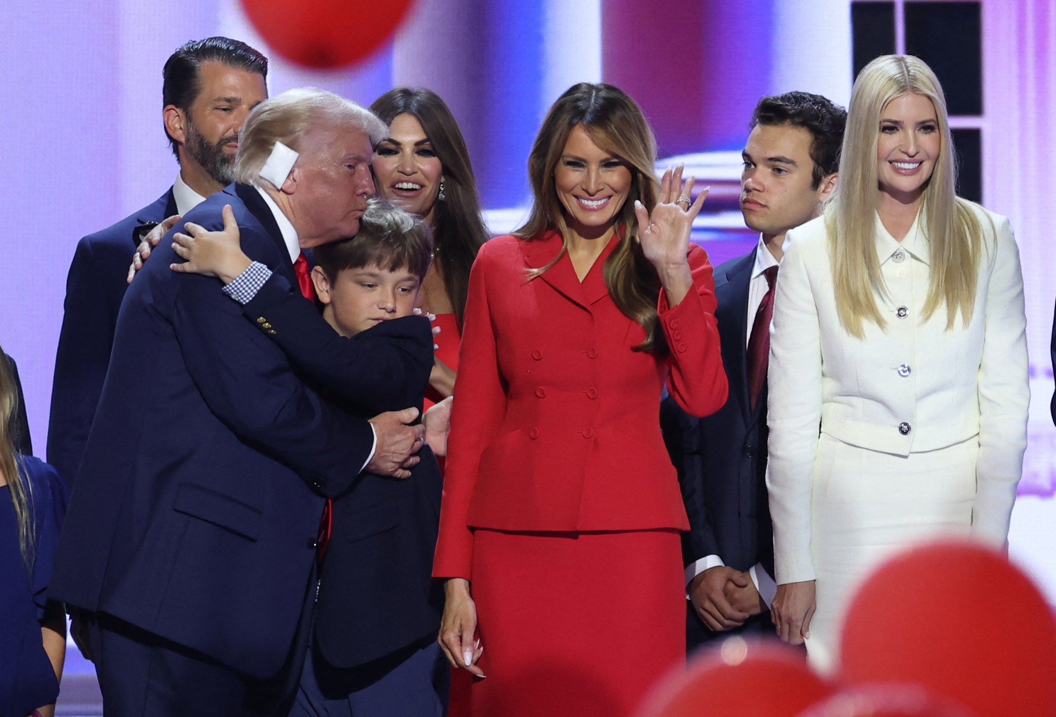 Former president Donald Trump is joined on stage by his wife Melania and other members of his family after his address to the Republican National Convention in Milwaukee.