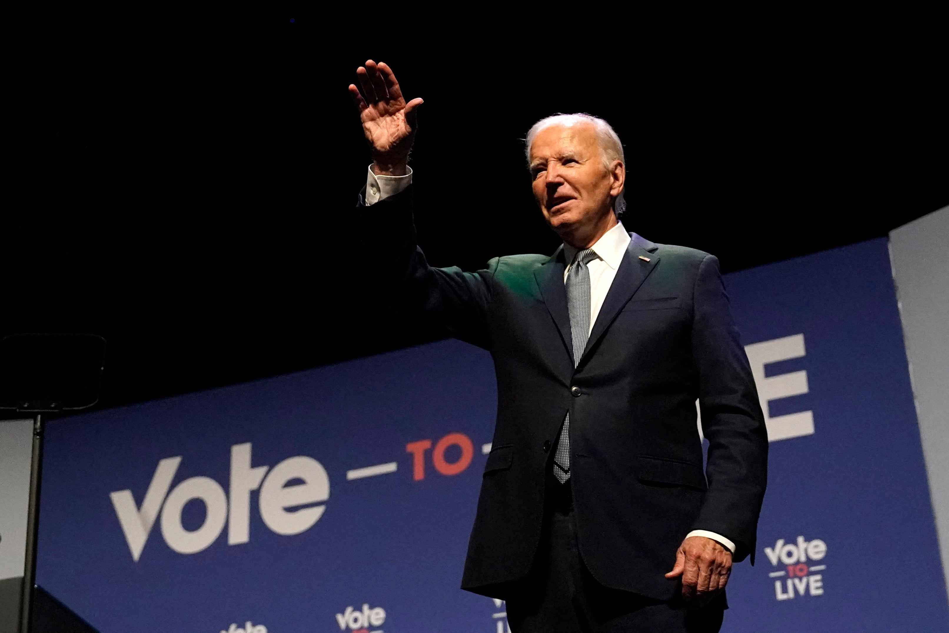 Joe Biden waves on stage during the Vote To Live Properity Summit at the College of Southern Nevada in Las Vegas on July 16, his last major campaign event before he was diagnosed with COVID-19 one day later