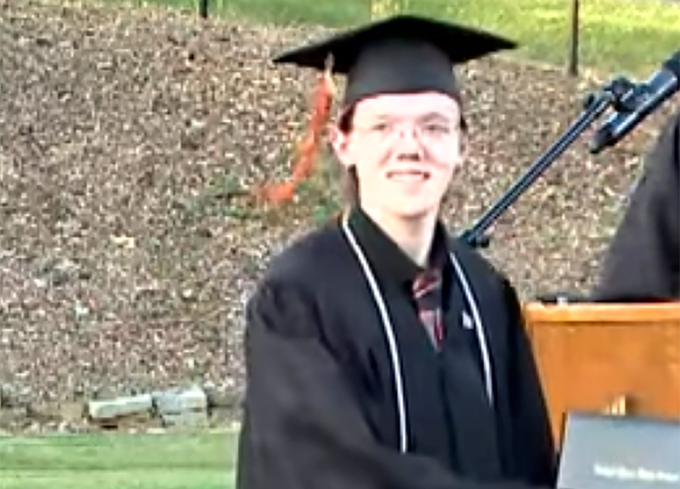 This still image taken from a video shows student Thomas Matthew Crooks in the 2022 Bethel Park High School Commencement in Bethel Park, Pennsylvania. He searched for information about both Donald Trump and Joe Biden before the shooting