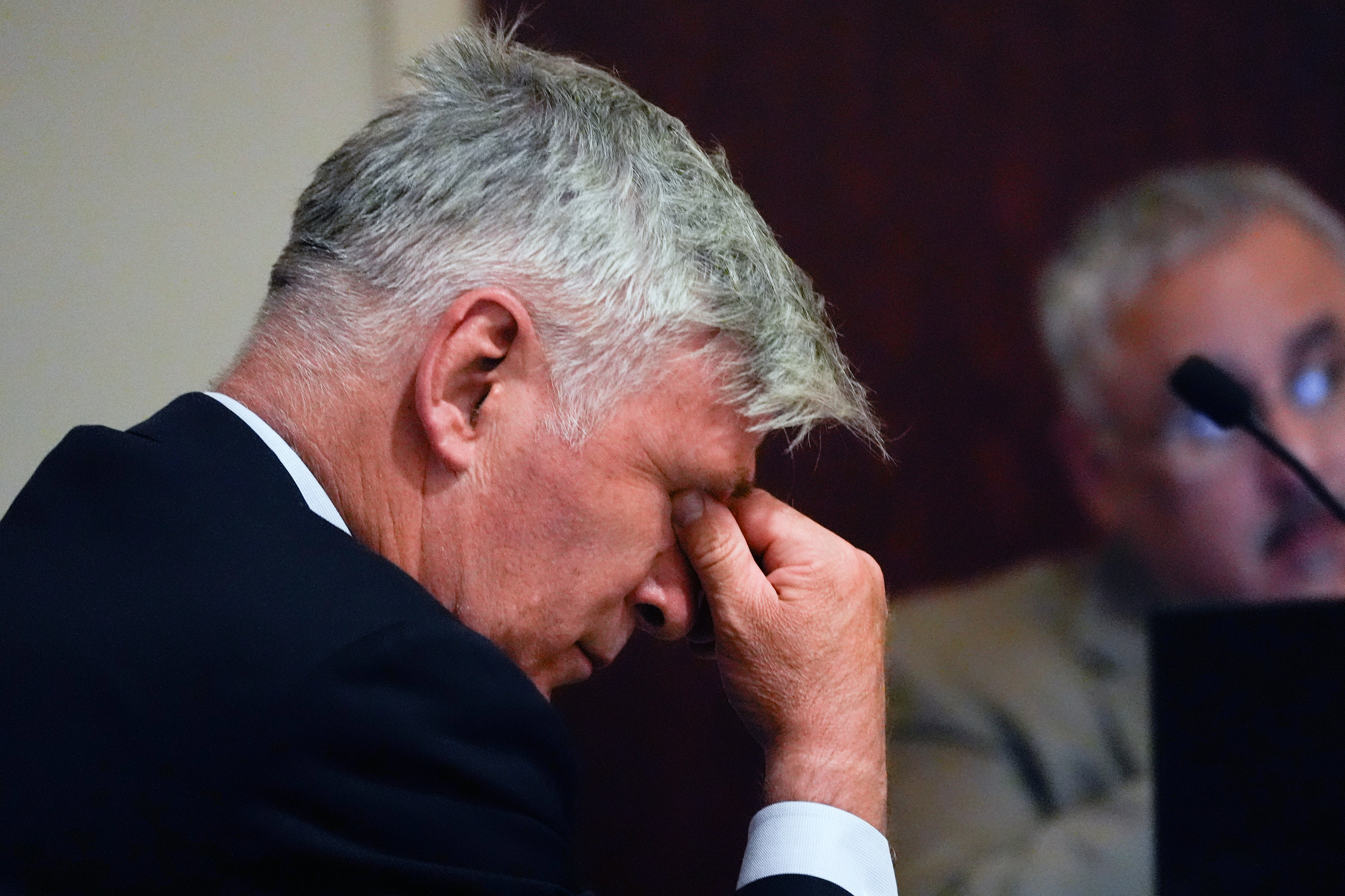 Alec Baldwin wipes his eyes during a pretrial hearing Monday, ahead of the start if his involuntary manslaughter trial, beginning on July 9