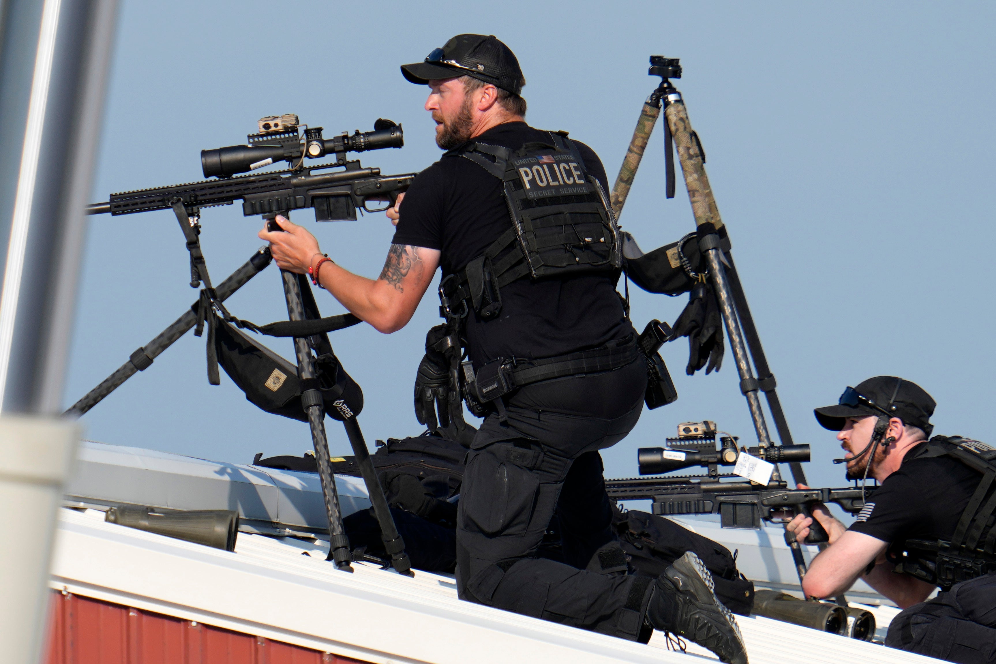 Police snipers return fire after shots were fired while Donald Trump was speaking at a campaign event in Butler