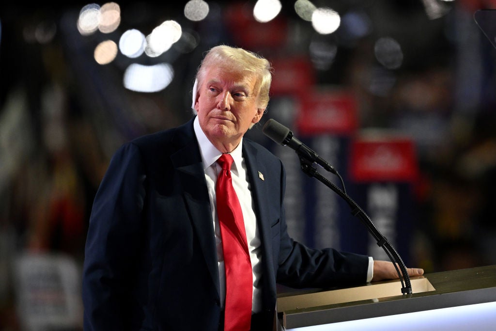 Donald Trump, with a bandage on his ear from an assassination attempt foiled at his rally on Saturday, speaks at the RNC after accepting the 2024 Republican nomination for president