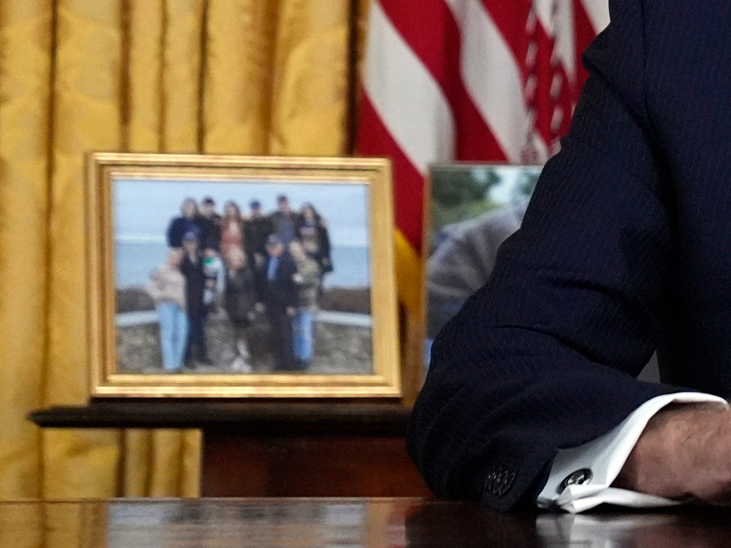 A Biden family photo sat to the president’s left as he spoke to Americans