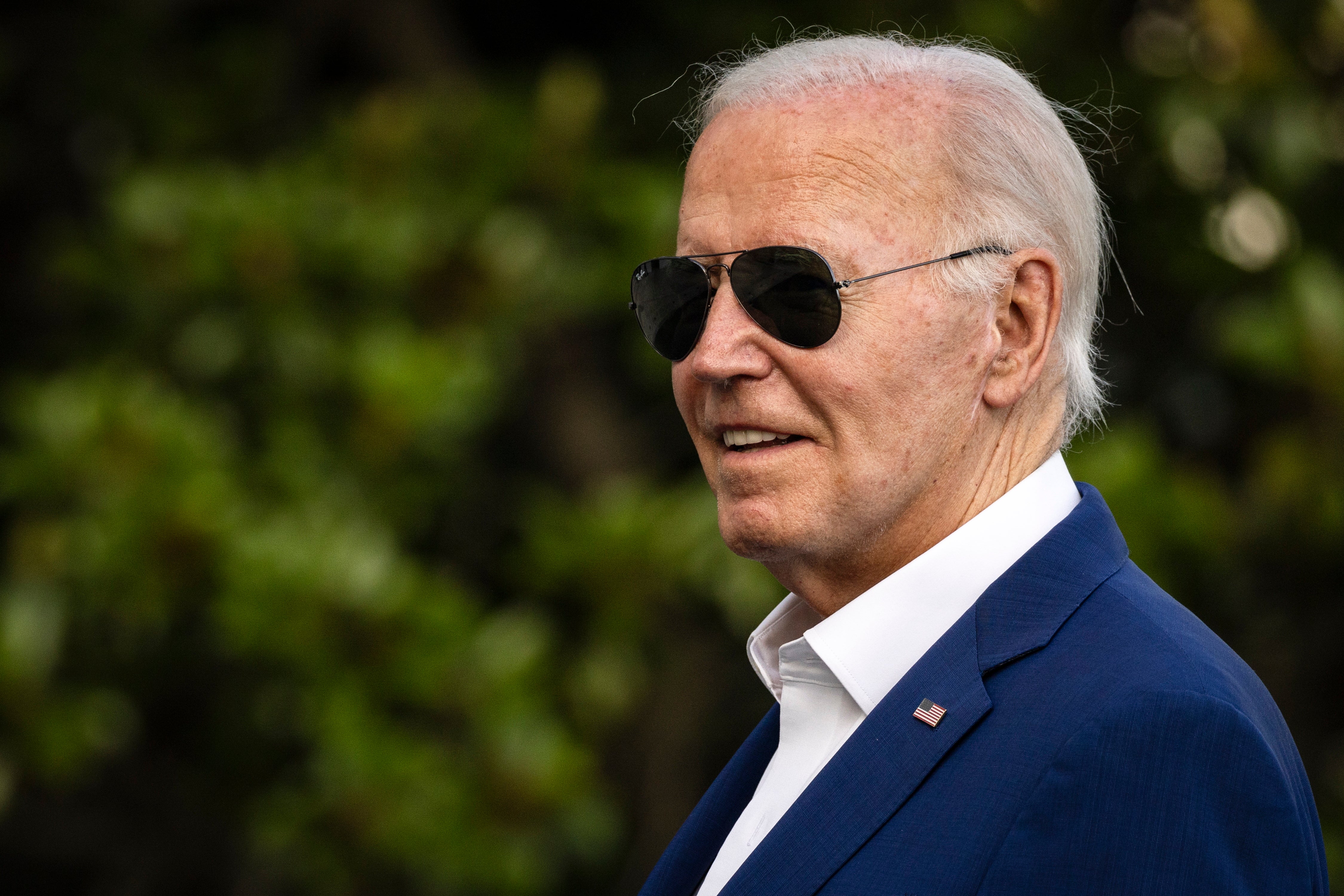 US President Joe Biden looks towards reporters as they shout questions as he walks towards the White House after landing on Marine One, in Washington, DC, 7 July 2024. There’s ‘unease’ in the White House regarding if he’ll continue his re-election campaign