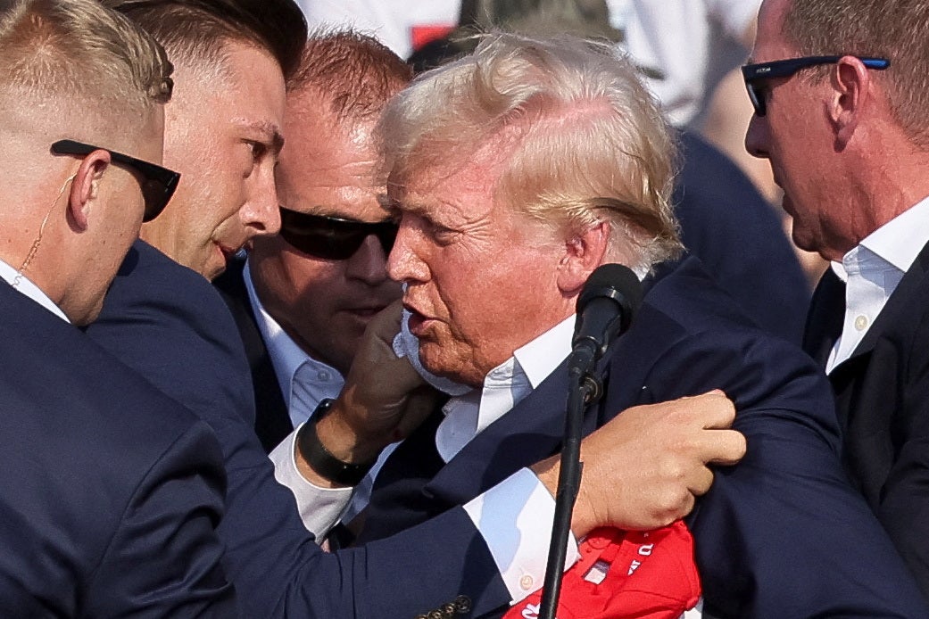 Trump was covered by Secret Service agents as he was let from the stage. Democratic Pennsylvania Governor Josh Shapiro said state police were working with federal colleagues