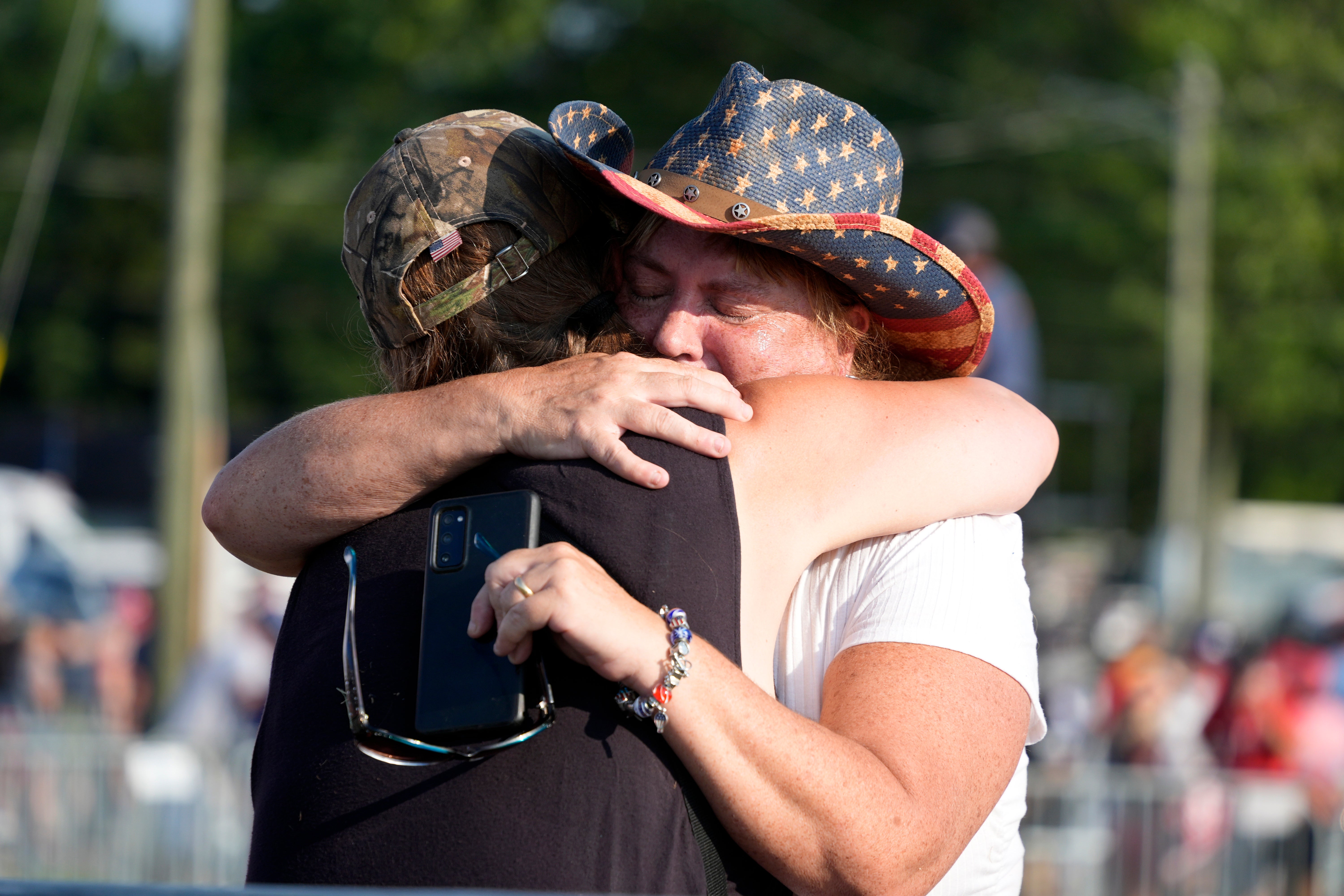 Audience members hugged and consoled each other after the dramatic moment. People yelled at others to ‘get down’ as the shots were heard