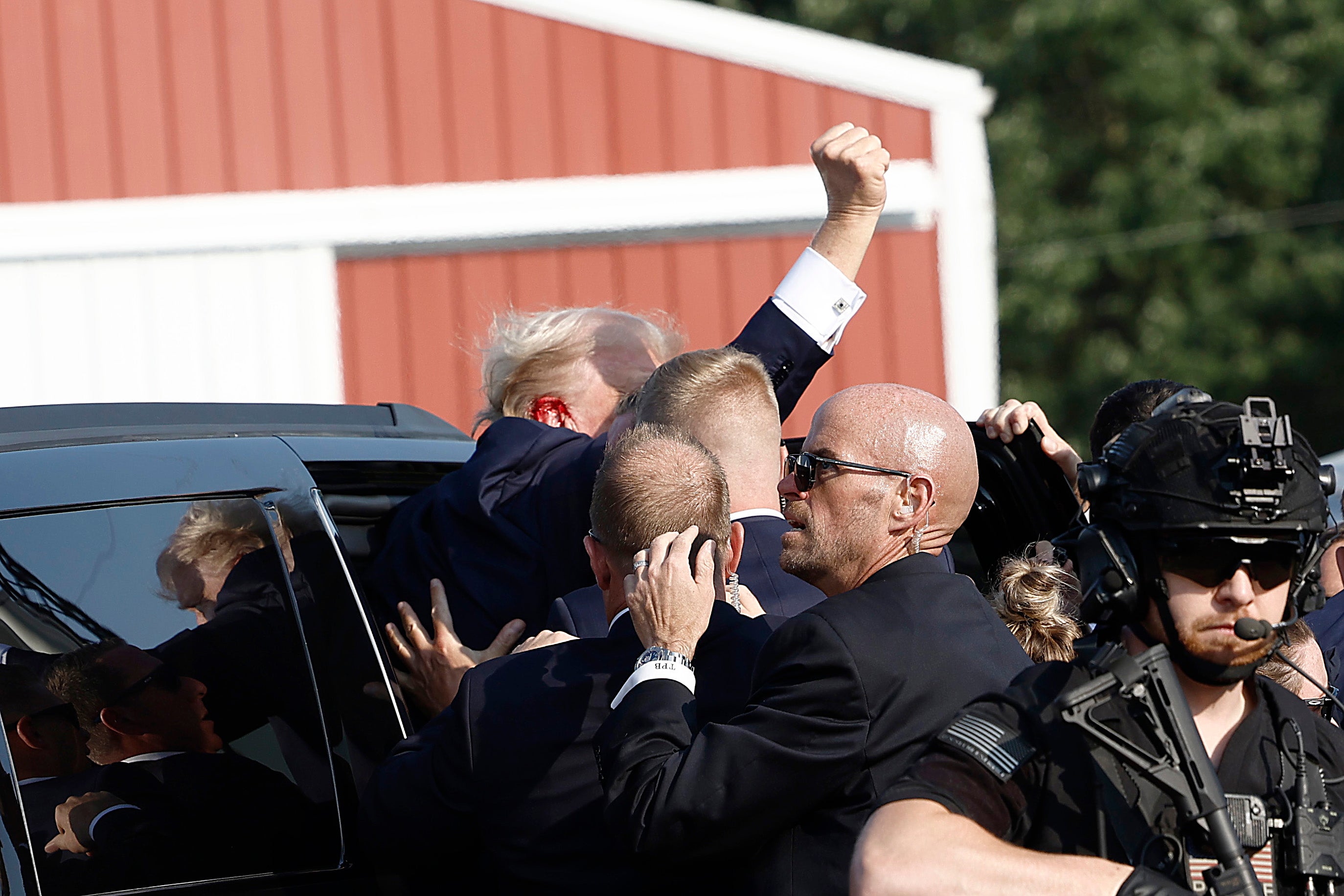 Trump was quickly taken away in his motorcade. Rally attendees have to go through security screenings, but the shooter was outside the perimeter