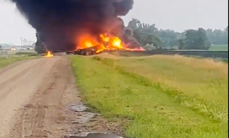 Train carrying hazardous material derails in North Dakota and catches fire