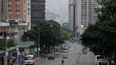 Normally bustling Venezuelan capital is unusually quiet after both sides claim victory in election