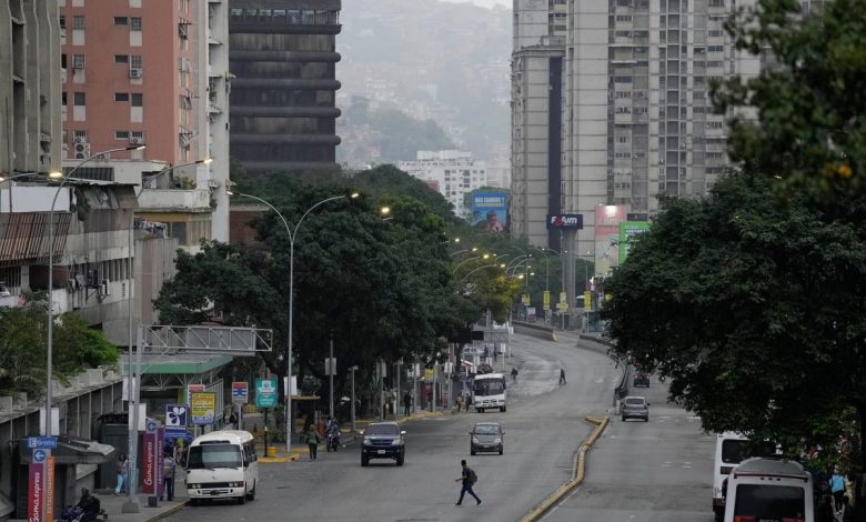 Normally bustling Venezuelan capital is unusually quiet after both sides claim victory in election