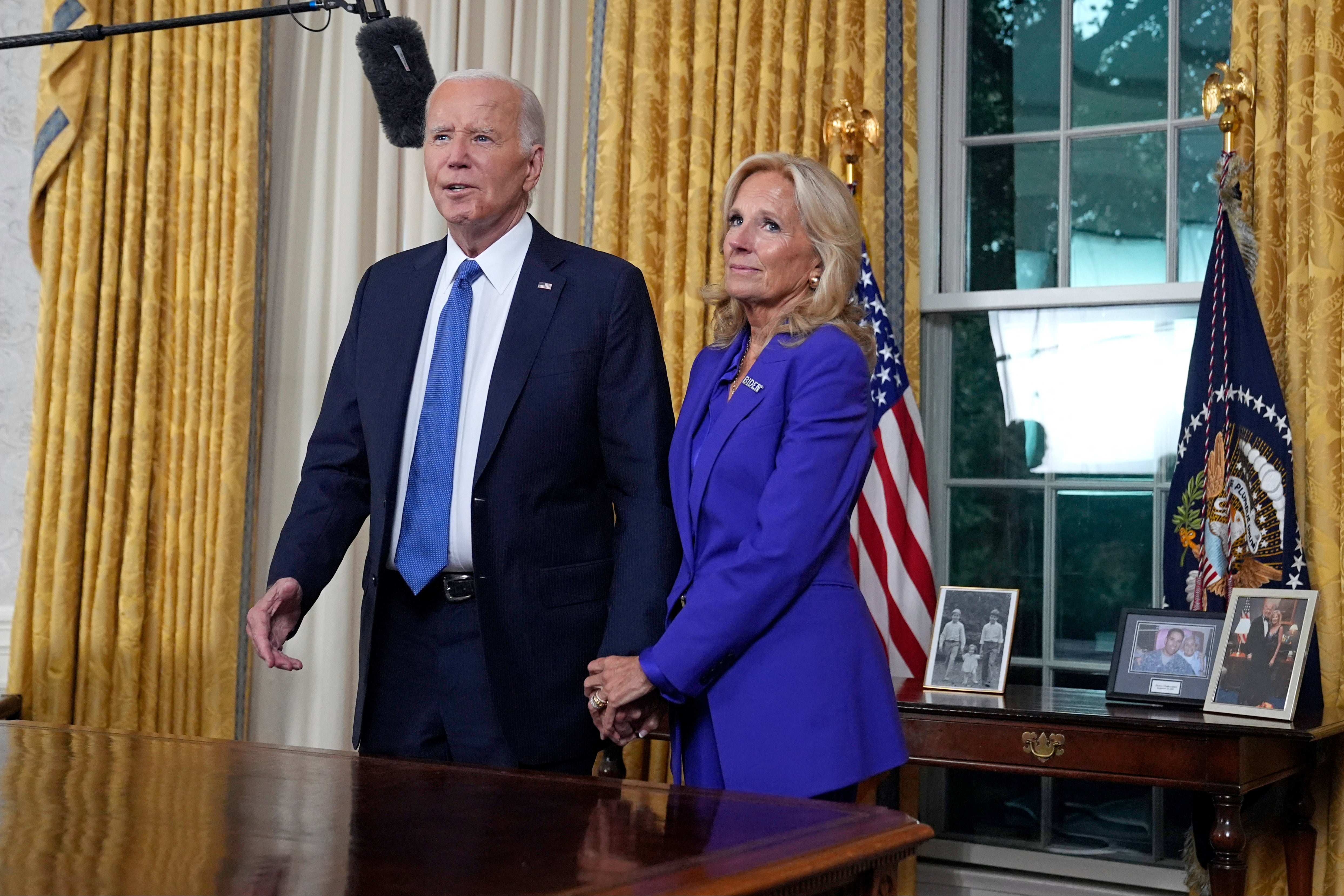 President Joe Biden stands next to First Lady Jill Biden as he was set to address the nation live on Wendesday