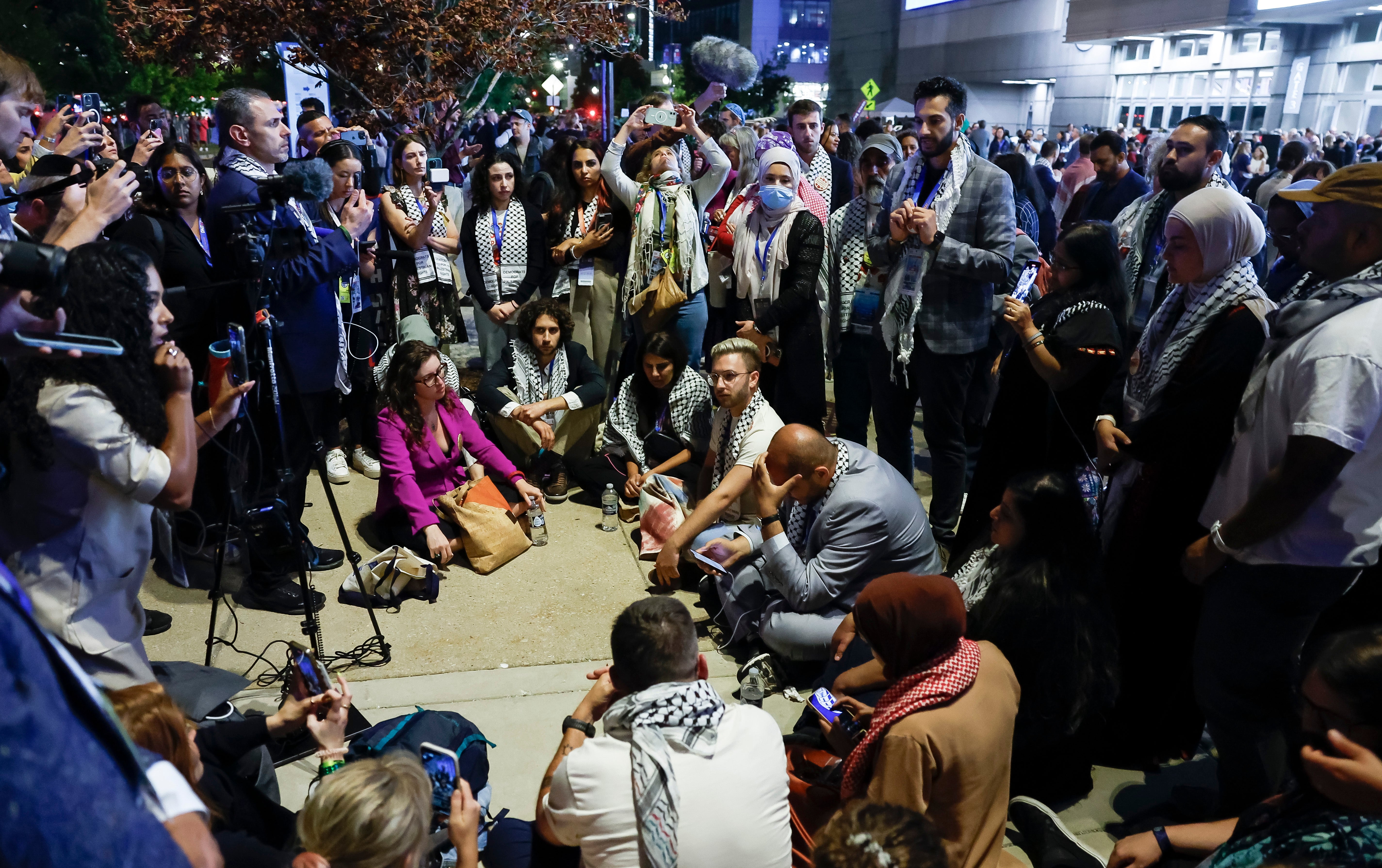 A group of ‘uncommitted’ delegates held a sit-in just outside the United Center to protest the lack of a Palestinian American speaker at the Democratic National Convention on August 21. The protests continued into the following day, ahead of Kamala Harris’s closing remarks.