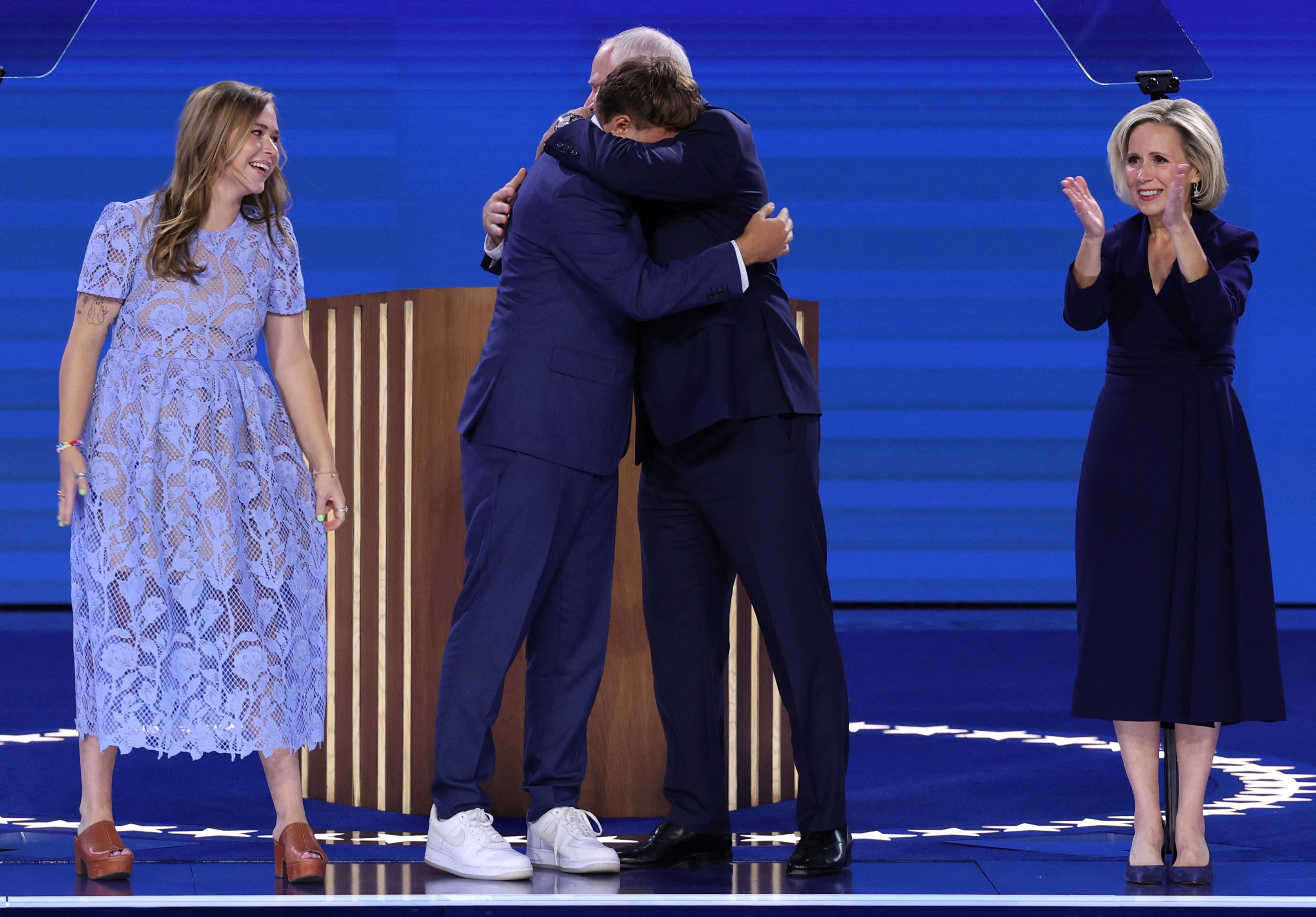 Minnesota governor Tim Walz hugs his son Gus as wife Gwen and daughter Hope look on