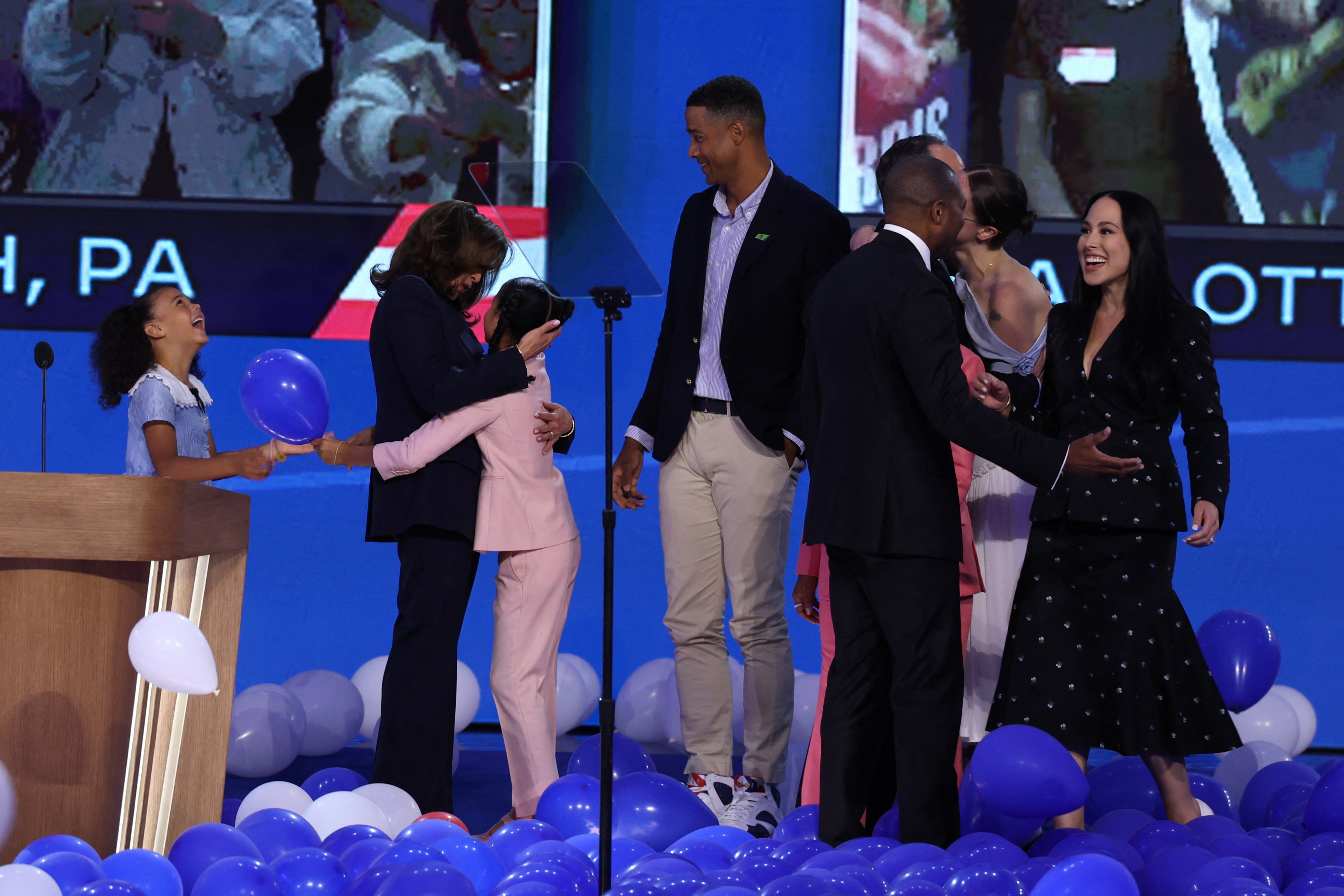 Kamala Harris celebrates with her great-nieces, Amara and Leela, after her Democratic nomination acceptance speech