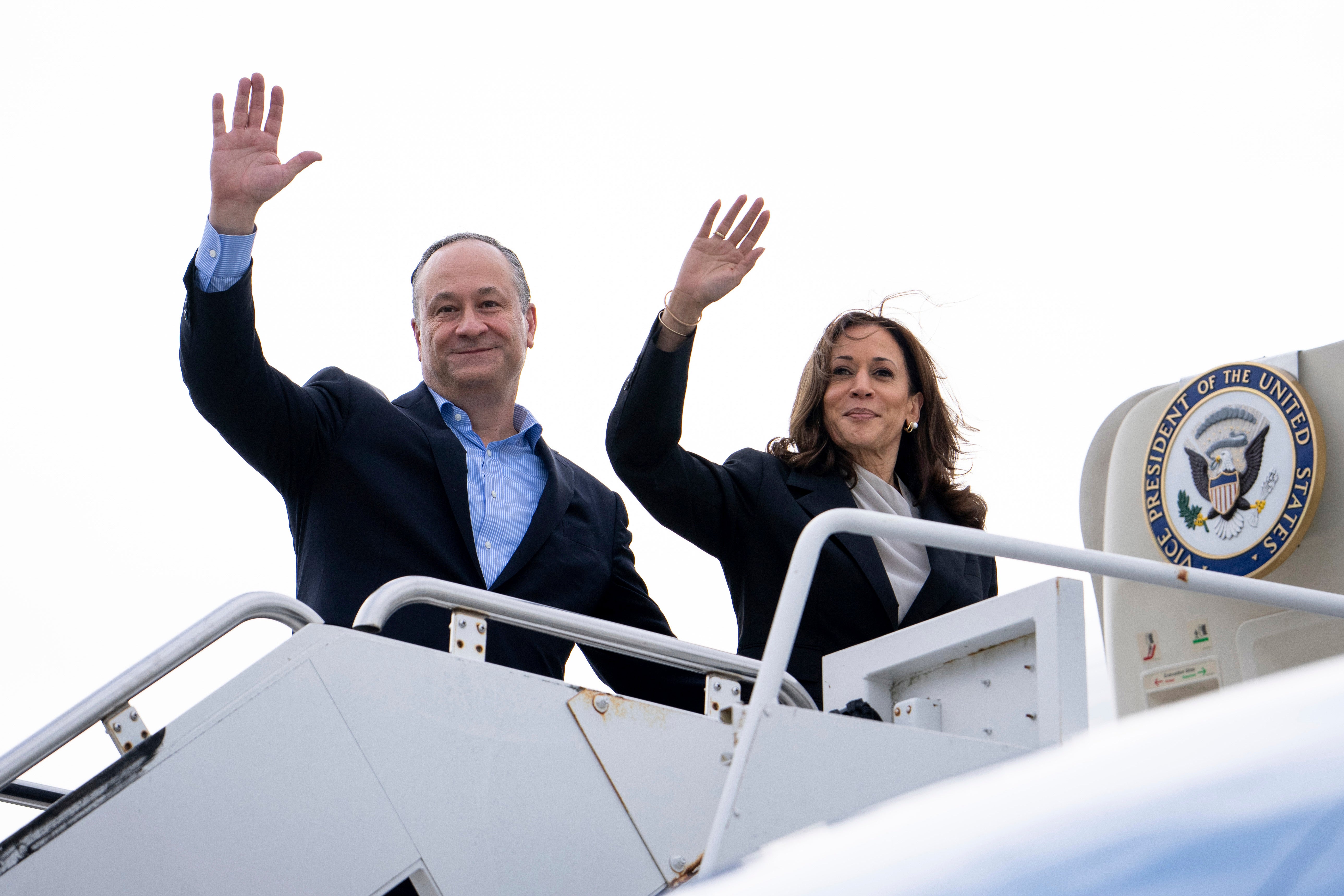 Doug Emhoff and Kamala Harris wave before boarding Air Force Two on July 22. Emhoff admitted to having an affair during his first marriage on Saturday