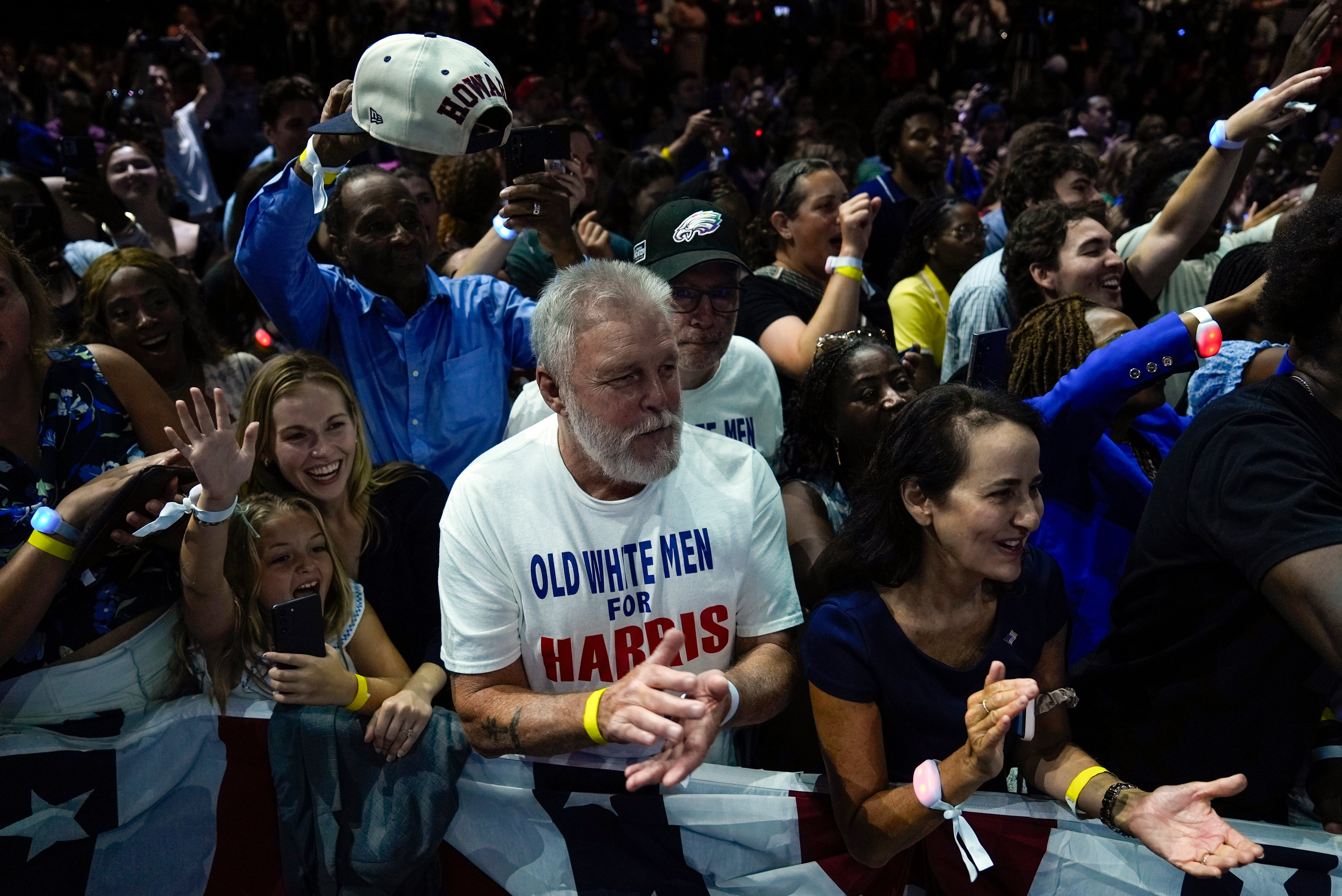 A Democratic supporter wears an ‘Old white men for Harris’ T-shirt