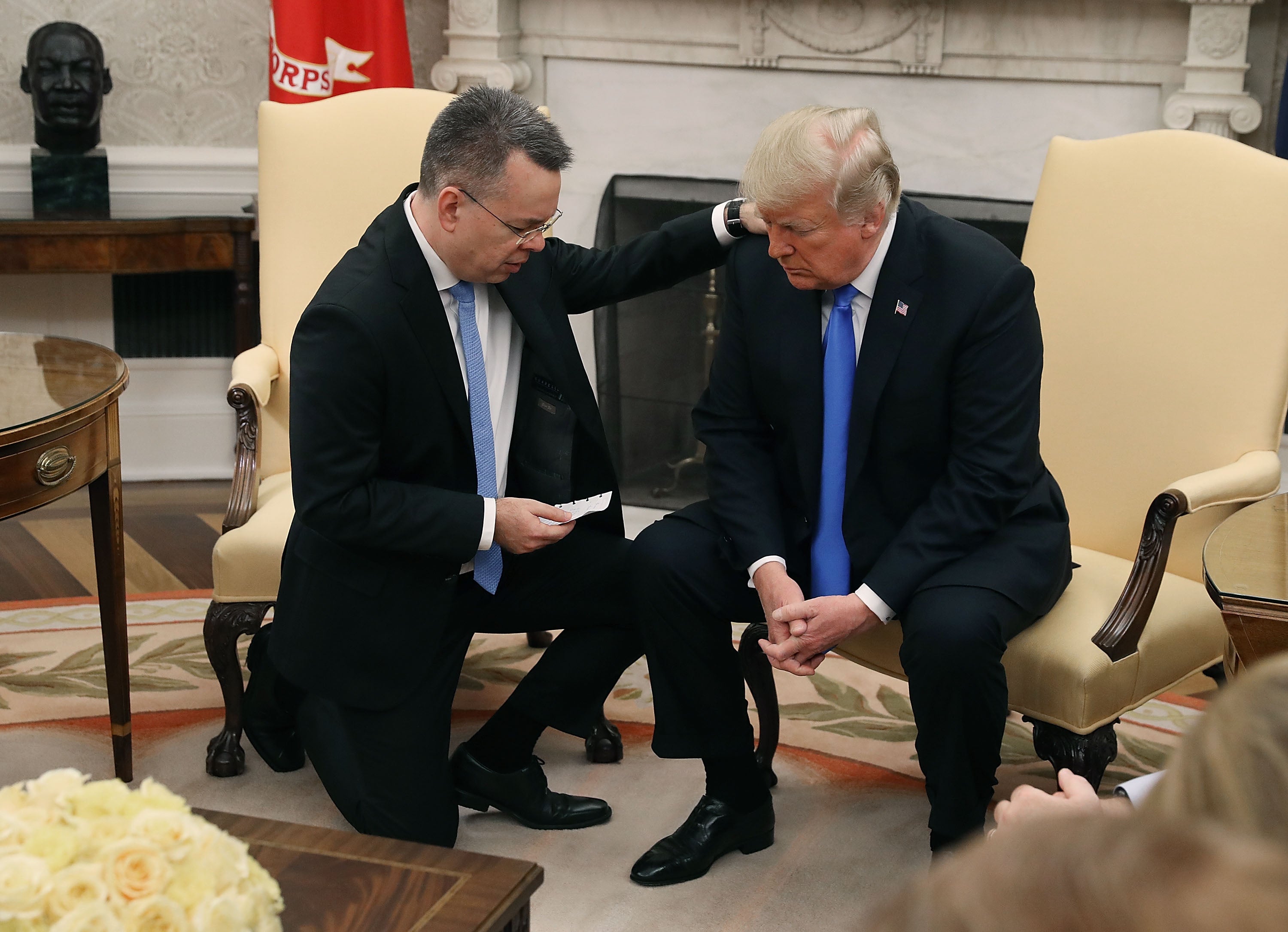 Trump and American evangelical preacher Andrew Brunson participate in a prayer in the Oval Office