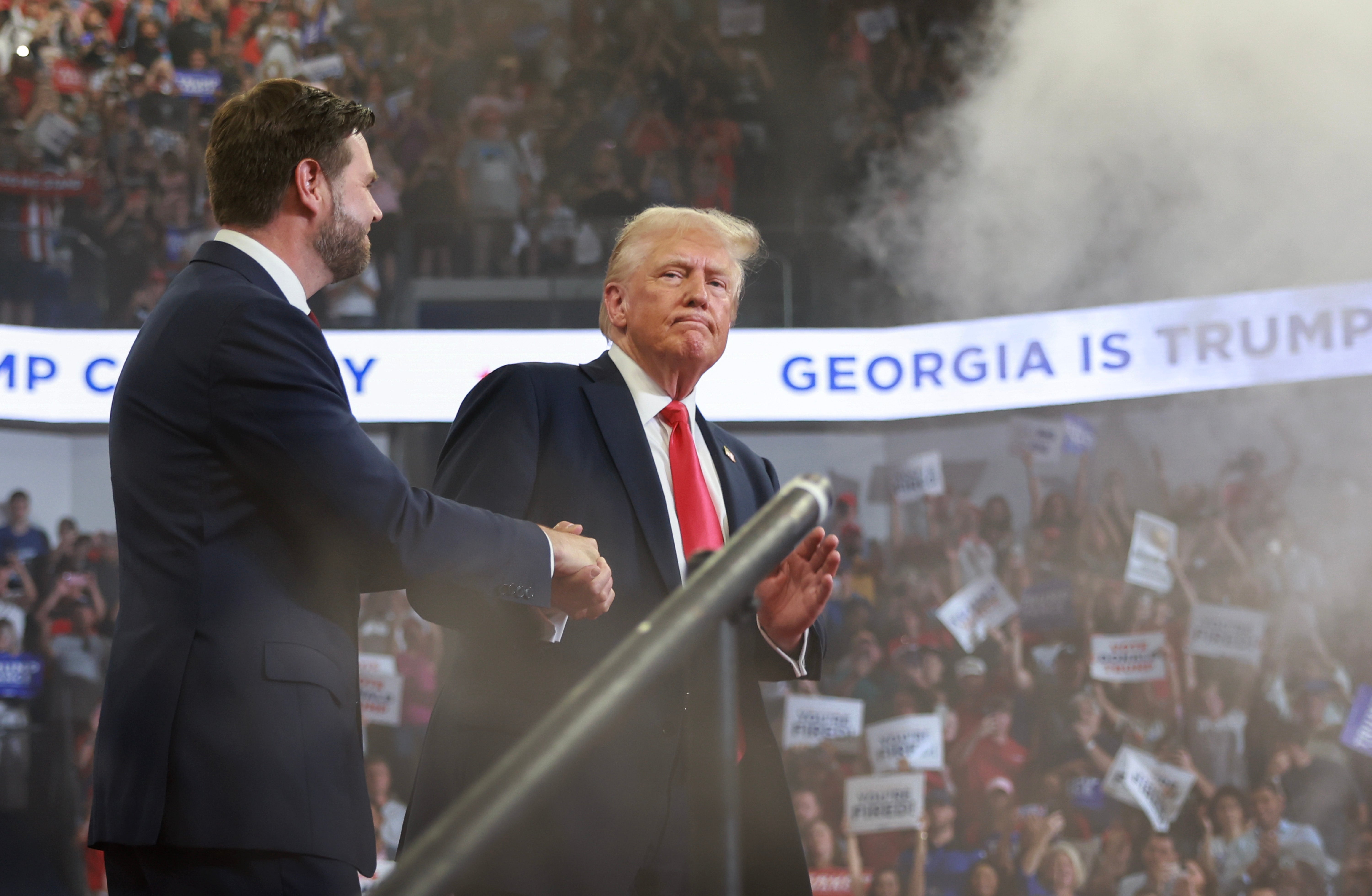 Donald Trump takes the stage with JD Vance during an August 3 rally in Georgia, where the former president praised election officials who approved rules that could make it easier for him to challenge 2024 results if he loses. A new report finds dozens of local officials who tried to reverse his loss in 2020 are still in power in 2024.